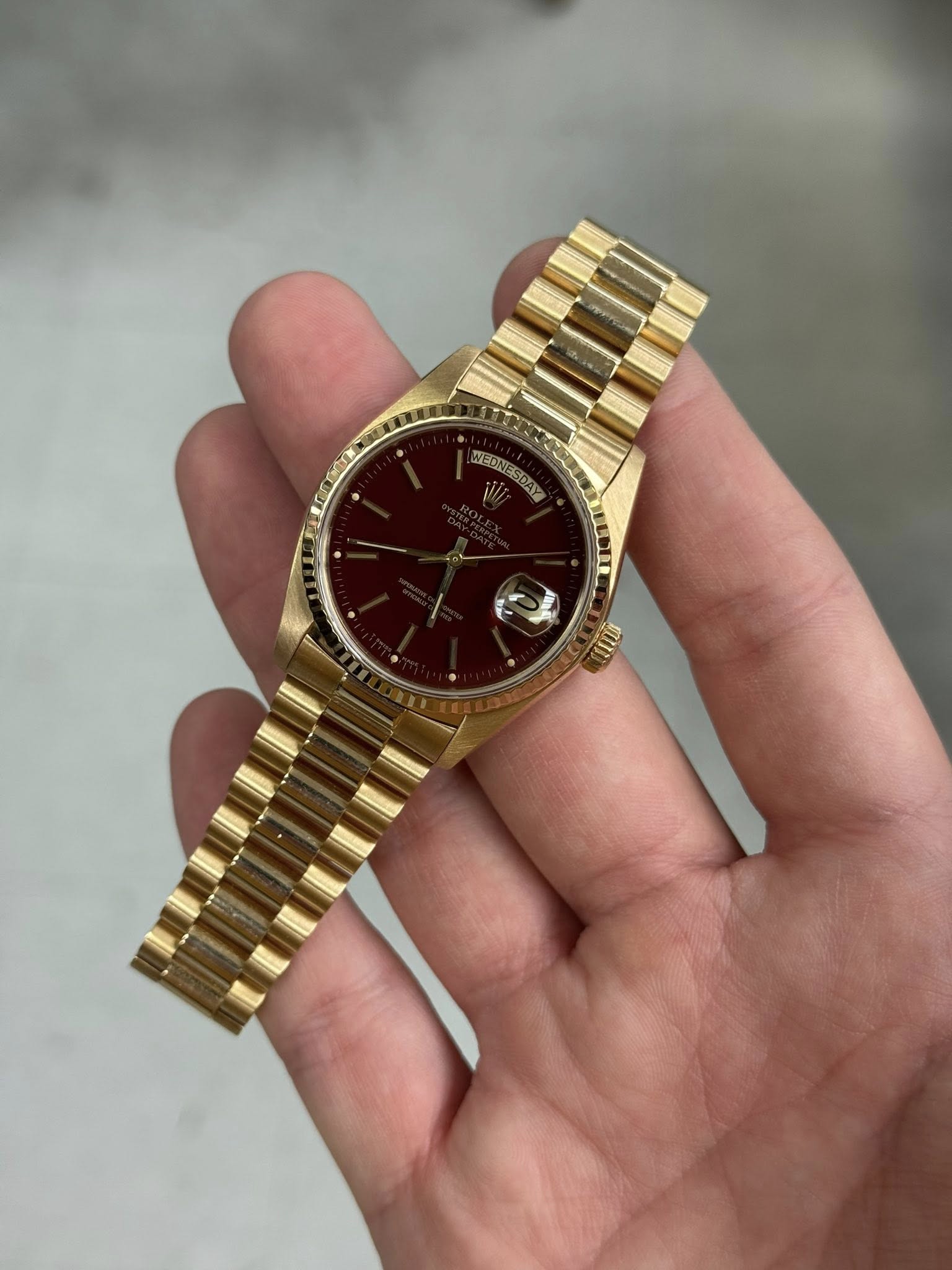 May be an image of wrist watch and text