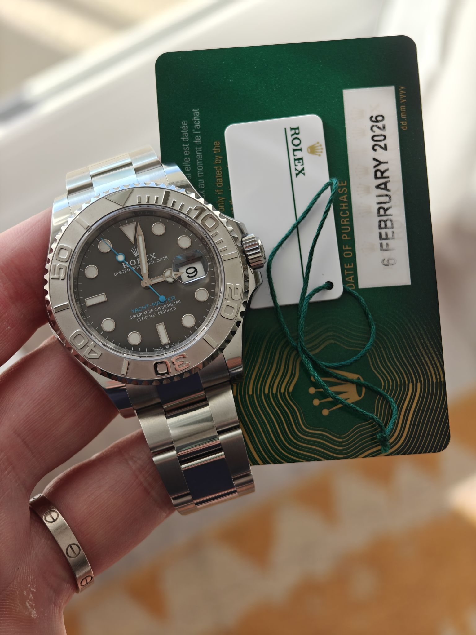 May be an image of wrist watch and text that says 'ROLEX R uI ROY 2026 FEBRUARY 6 50 psssssy 40 20 20 0a S'