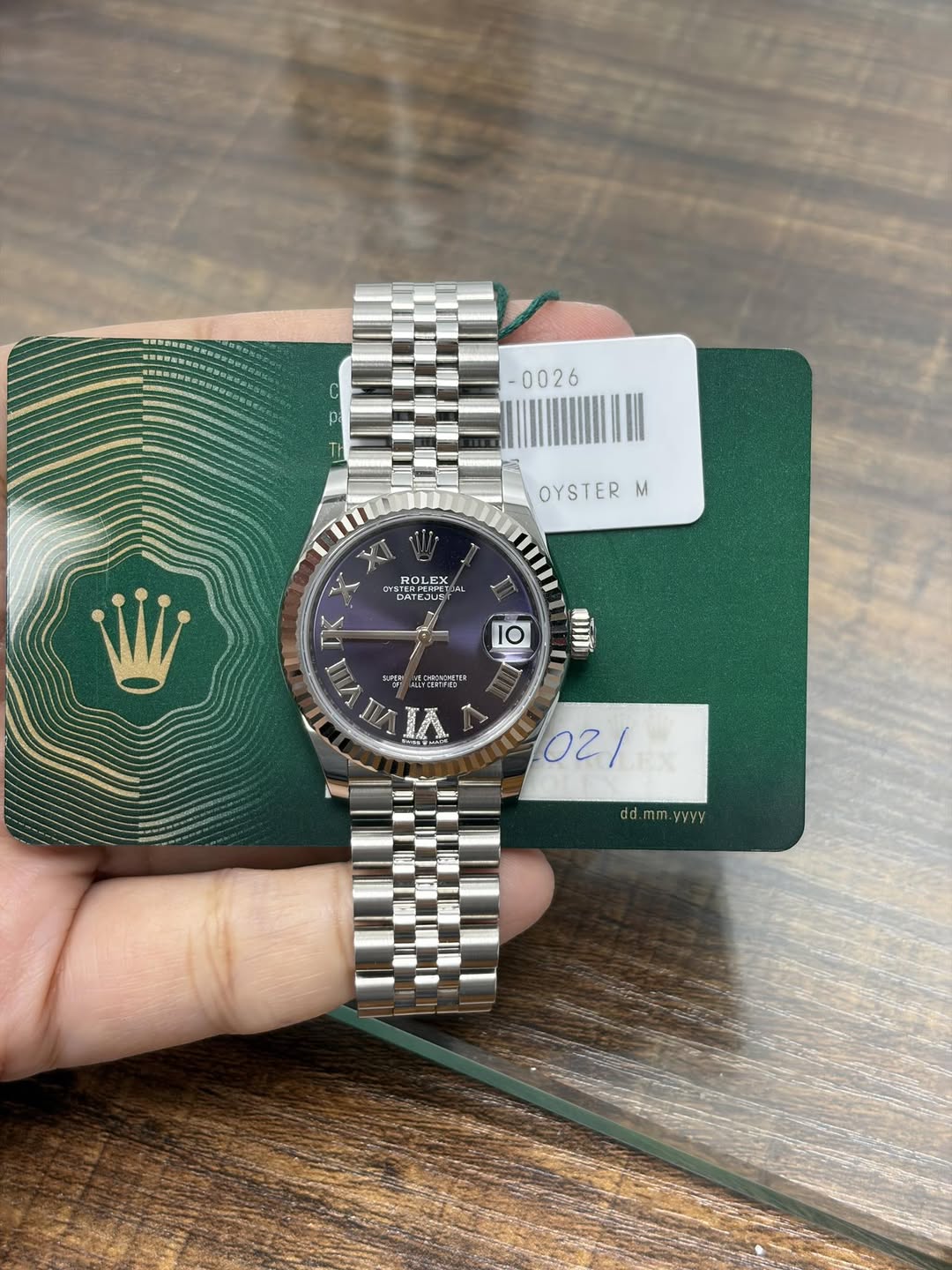 May be an image of wrist watch and text