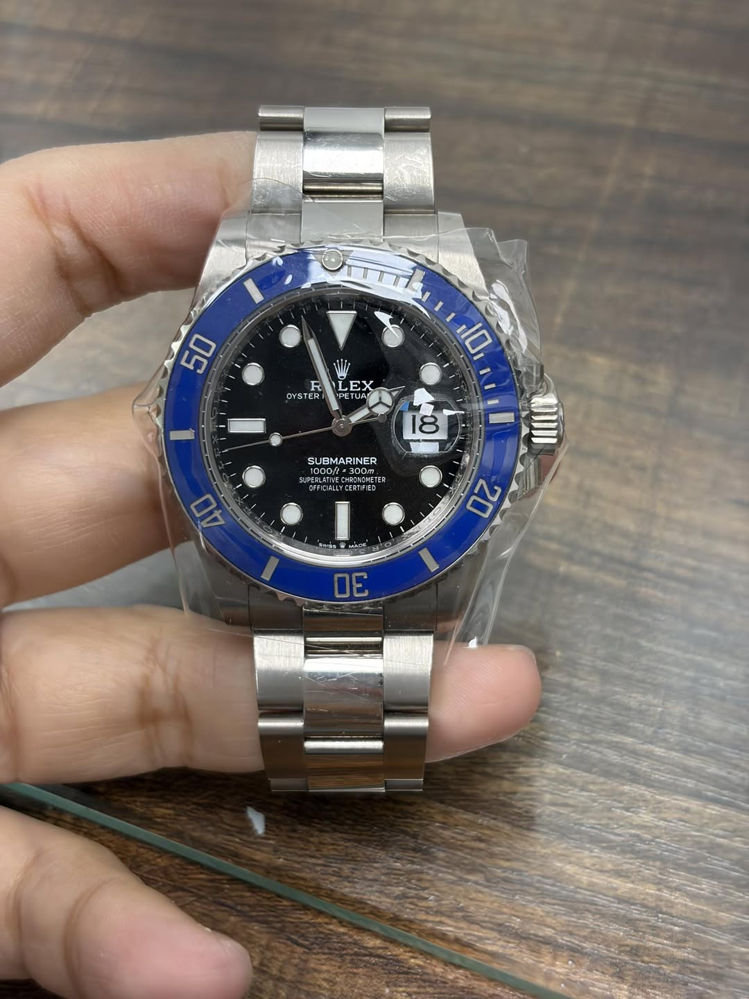 May be an image of wrist watch and text