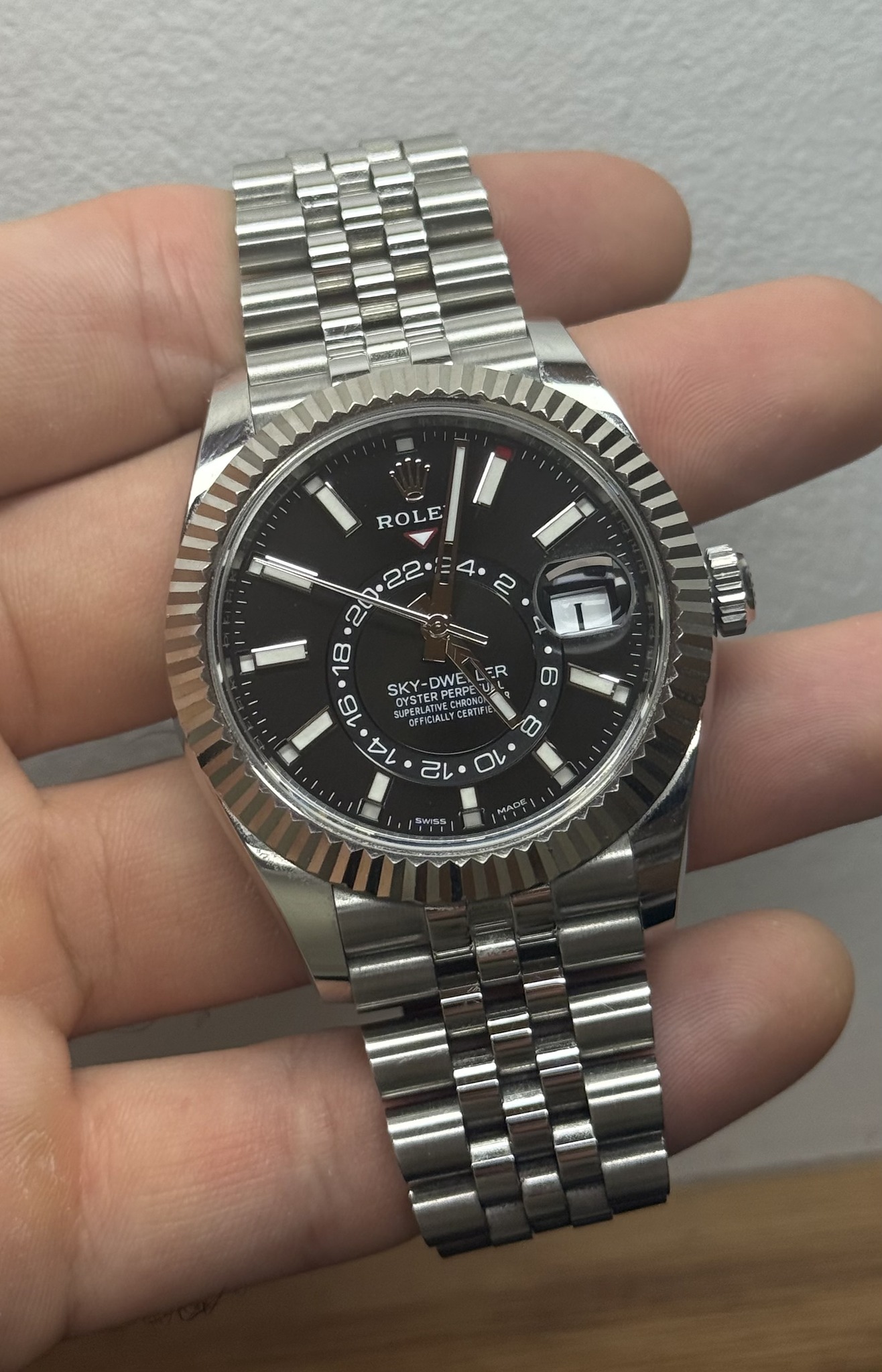 May be an image of wrist watch and text