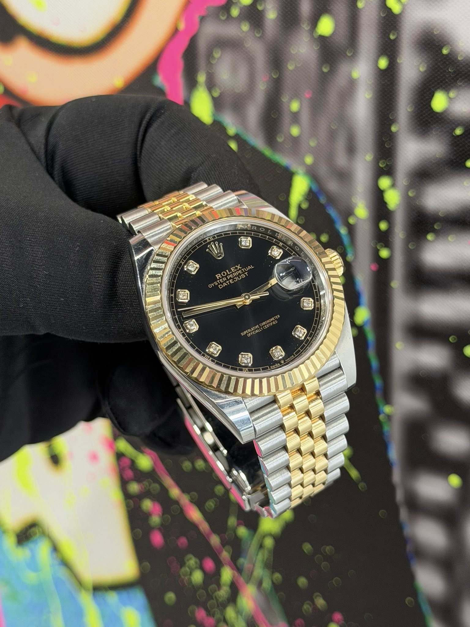 May be an image of wrist watch and text