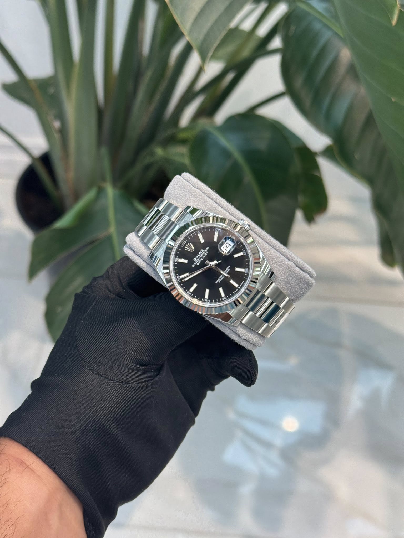 May be an image of wrist watch and text