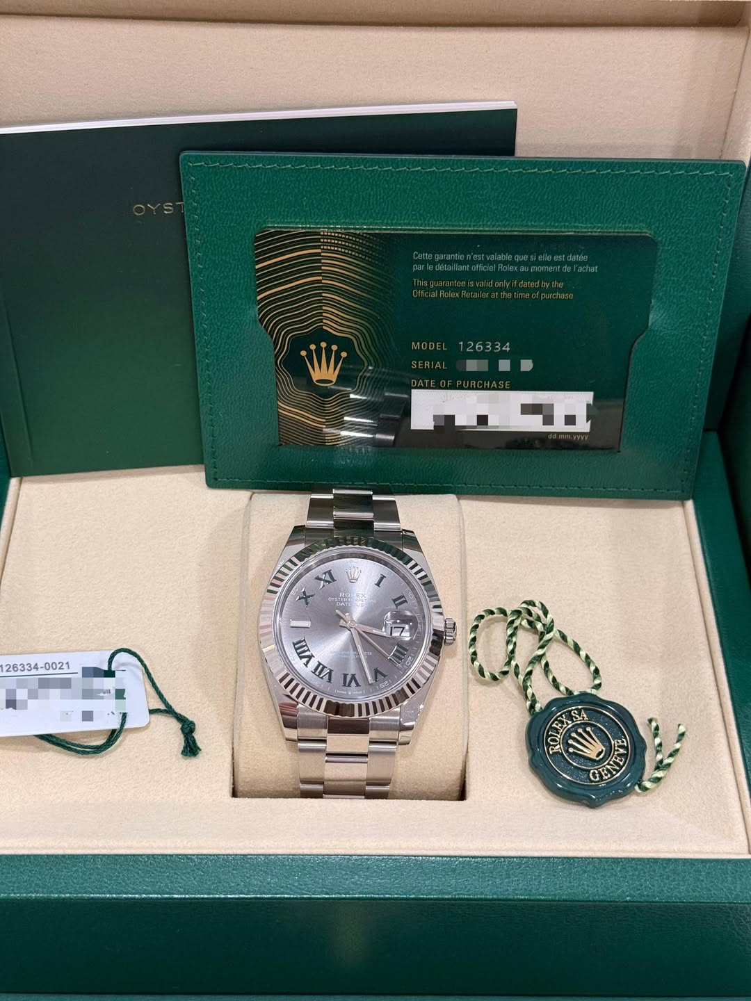 May be an image of wrist watch and text