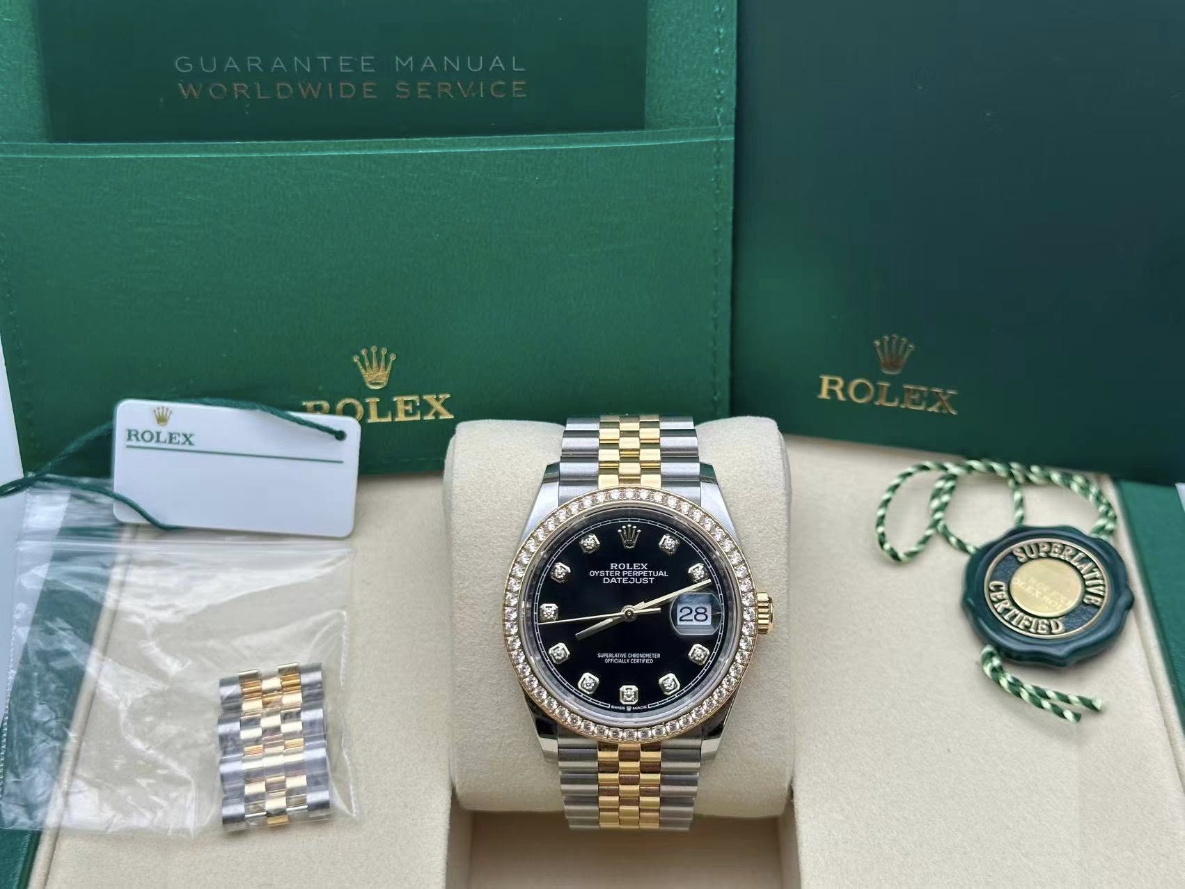 May be an image of wrist watch and text that says 'ROLEX ROLEX ROLEX RO 豊 心 প by 福 ROLI PER ROLEX STERPERPE YUR DATEJUS 80 28 C MLI B も SUP 6 EIRE TFIED B'