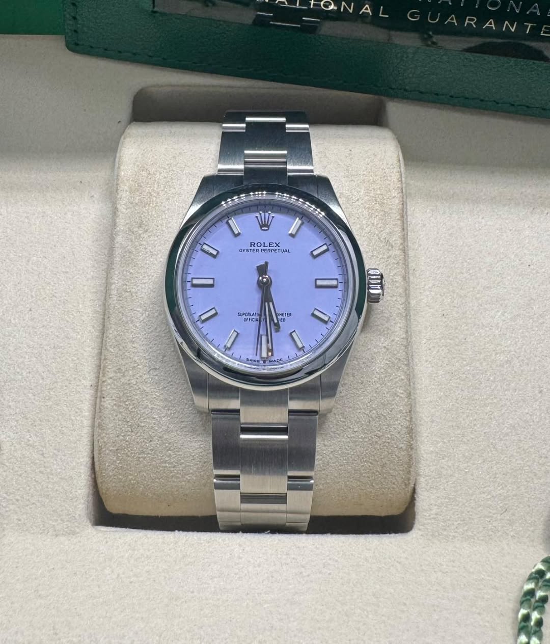May be an image of wrist watch and text
