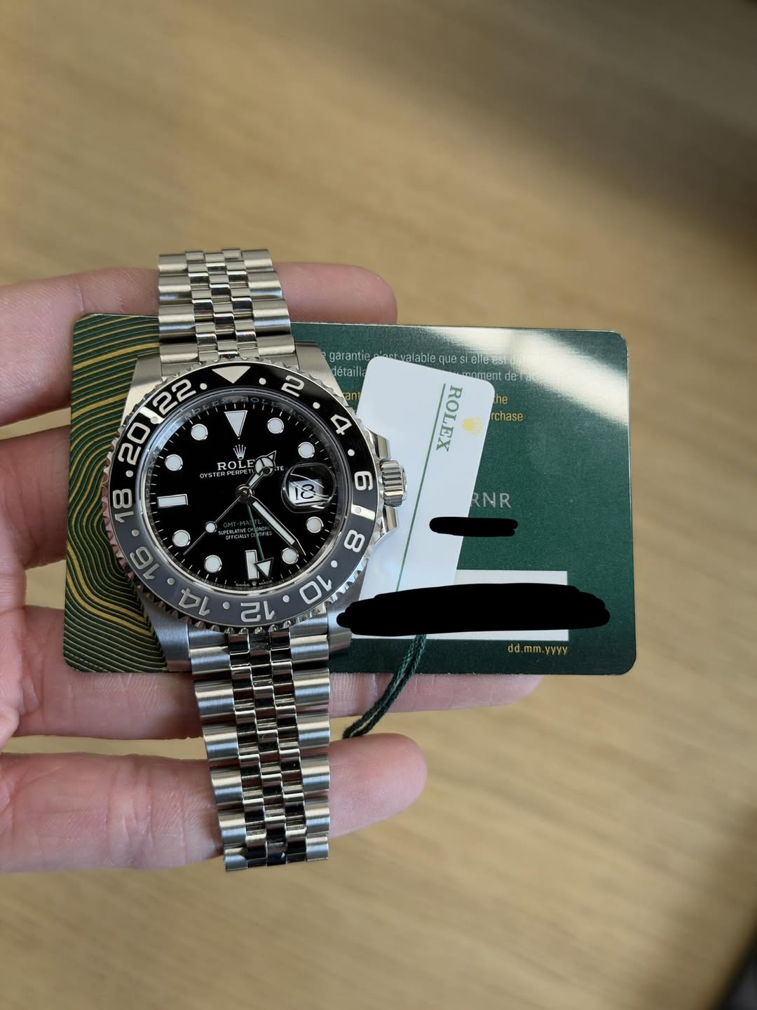 May be an image of wrist watch and text