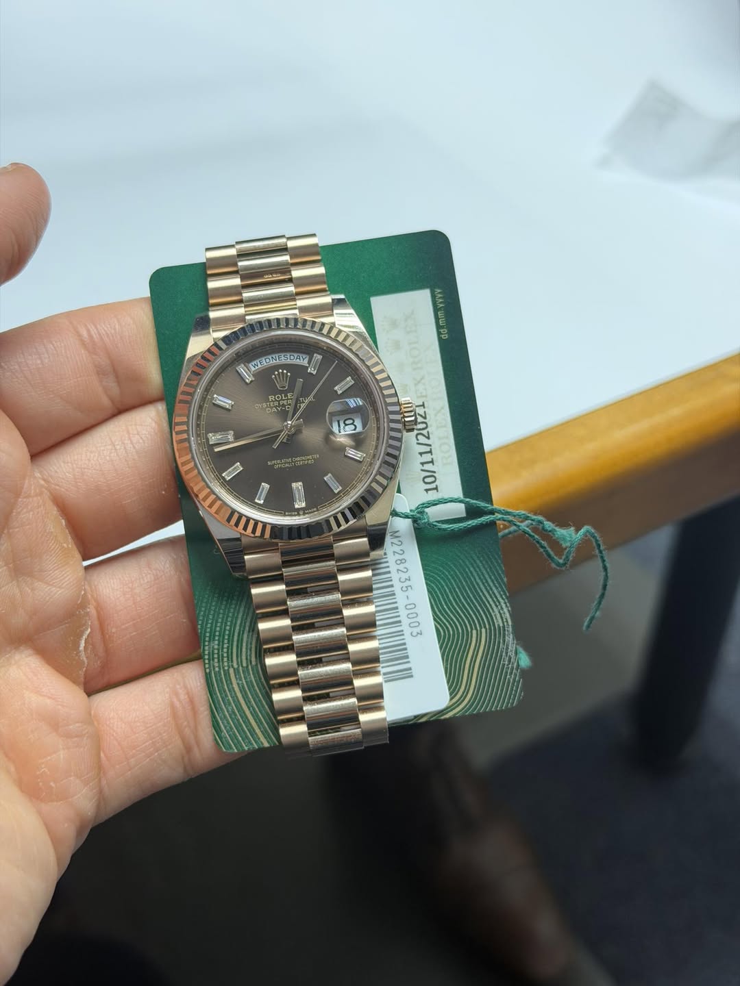 May be an image of wrist watch and text