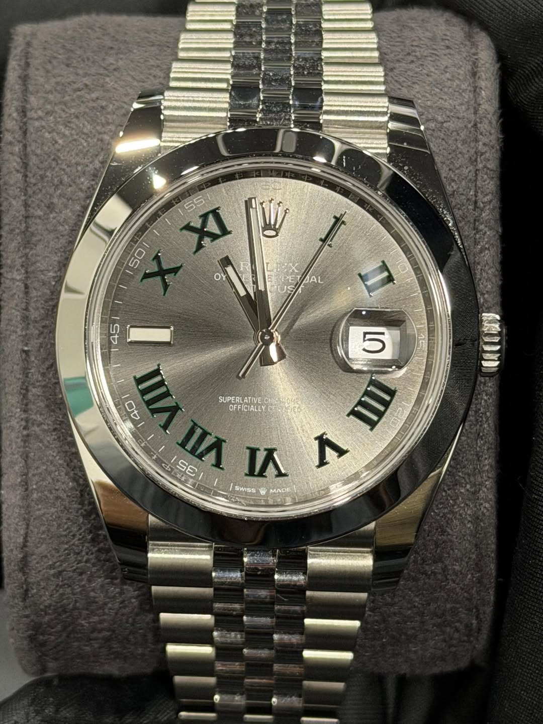 May be an image of wrist watch and text