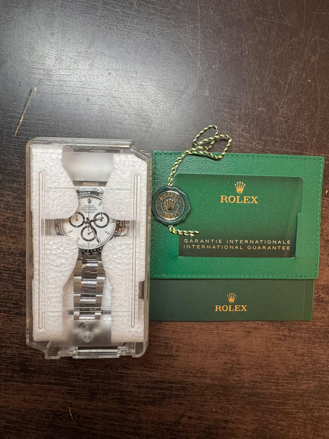 May be an image of fragrance, lighter and text