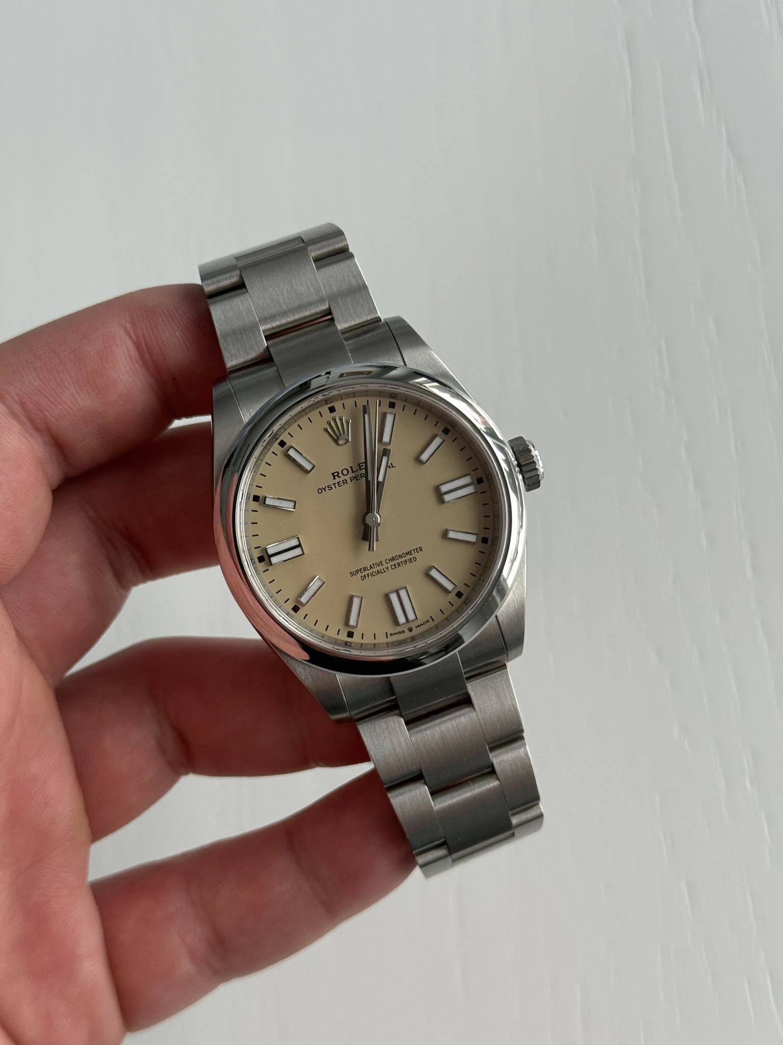 May be an image of wrist watch and text