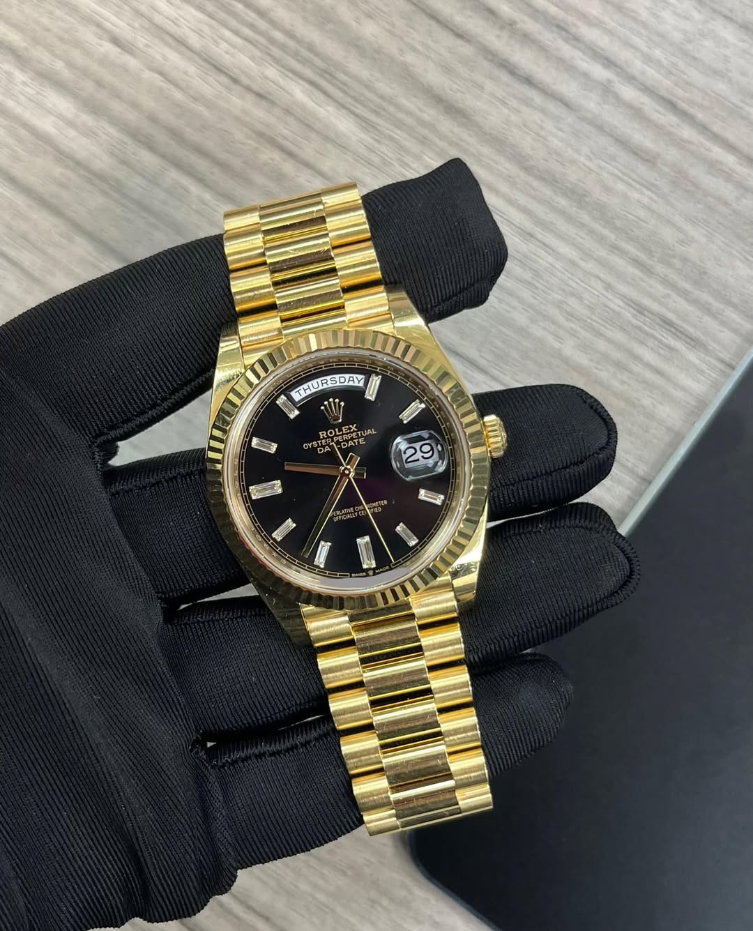 May be an image of wrist watch and text