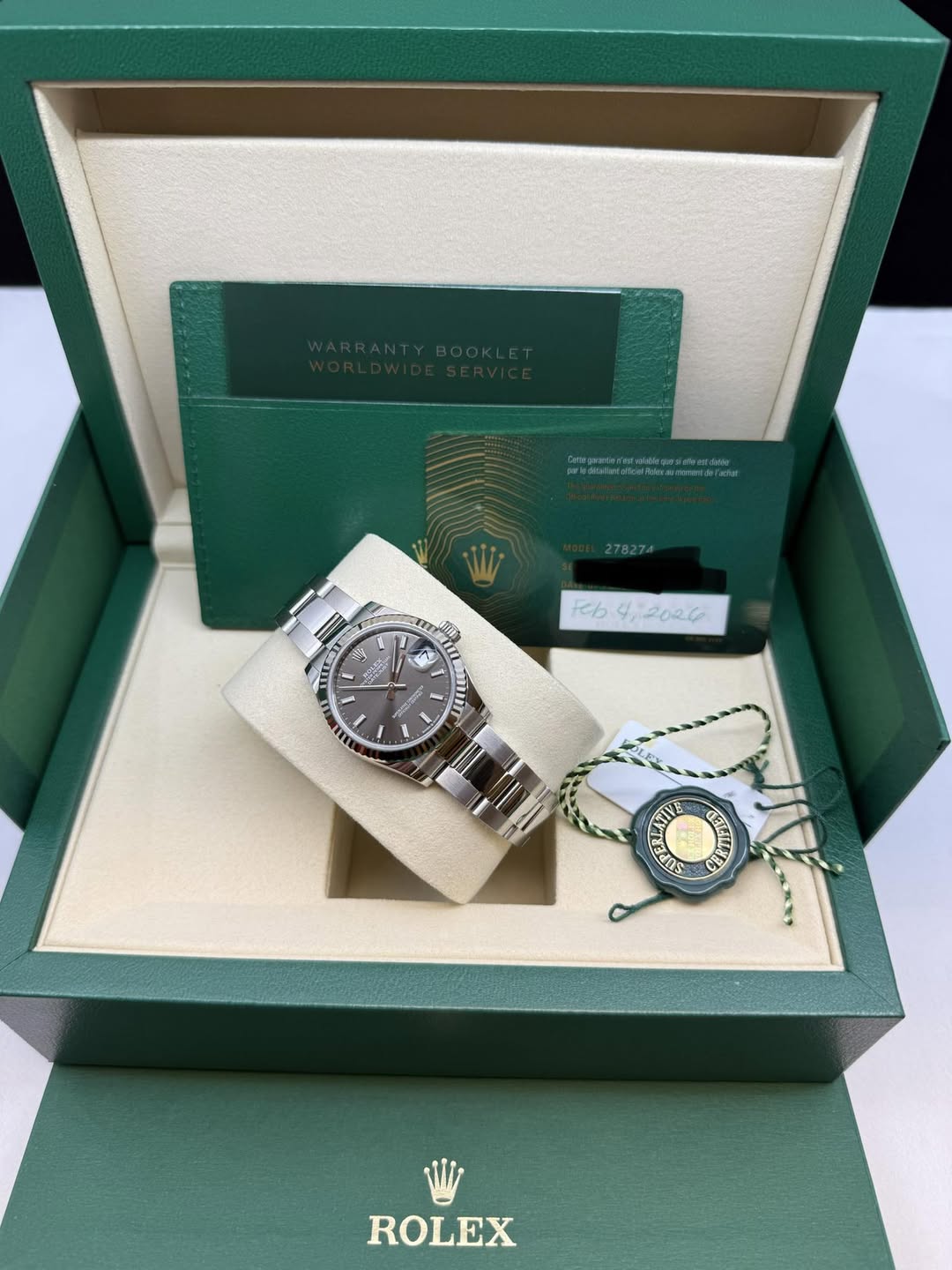 May be an image of wrist watch and text