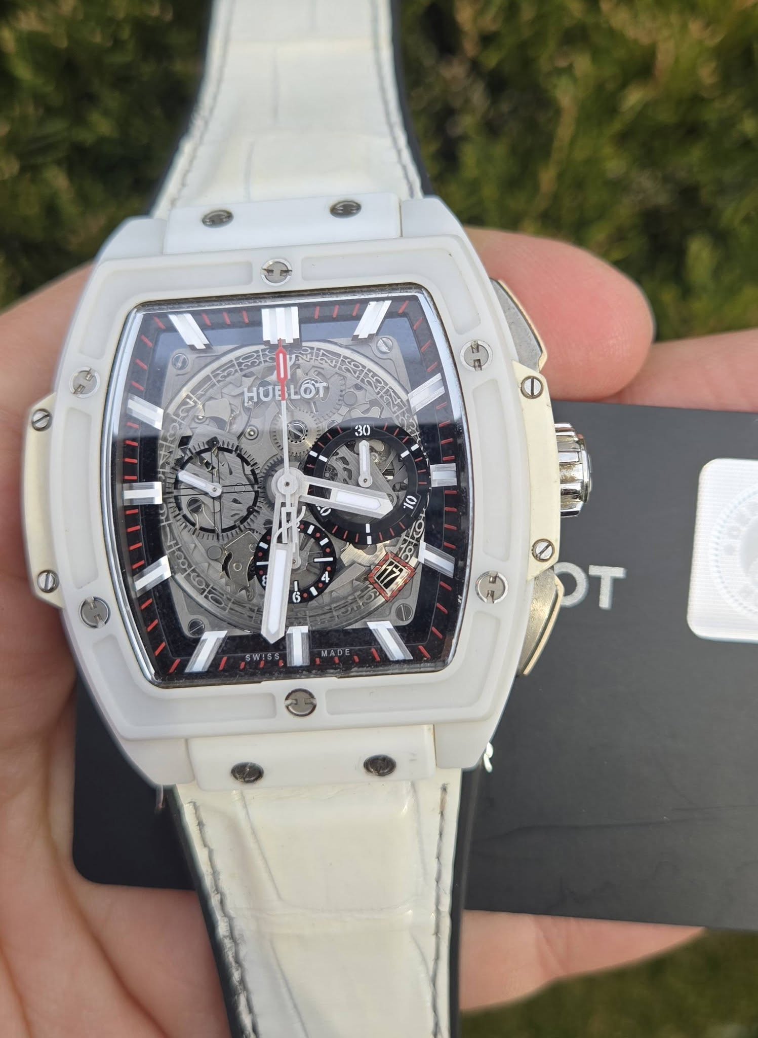 May be an image of wrist watch and text