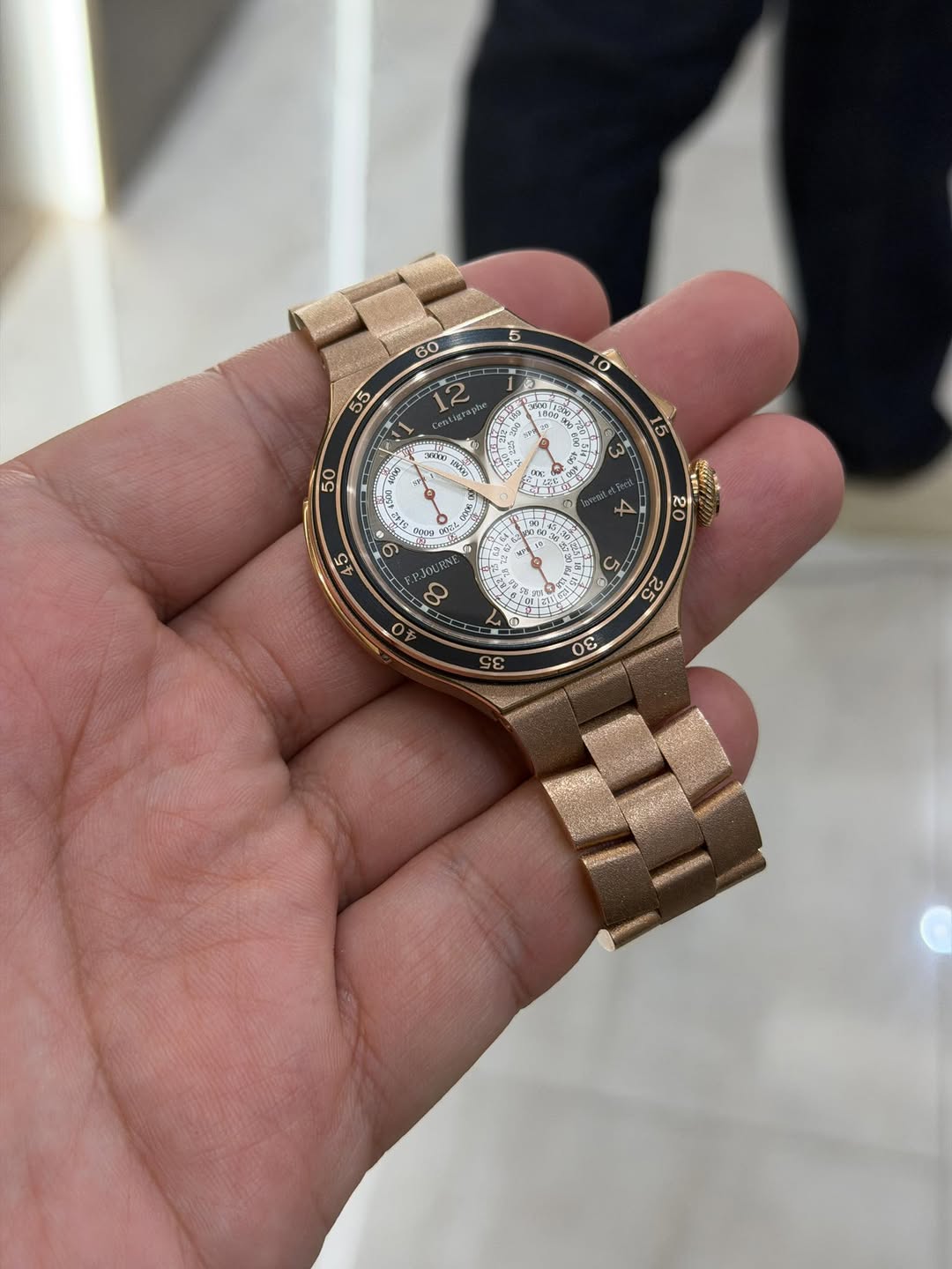 May be an image of wrist watch and text