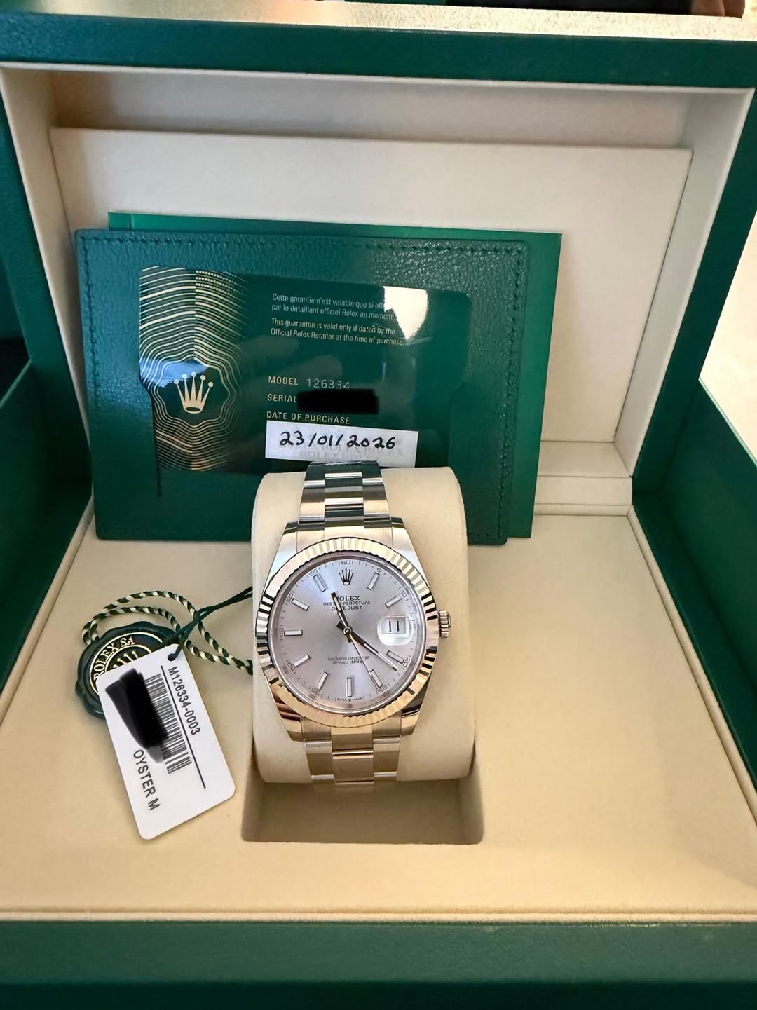 May be an image of wrist watch and text