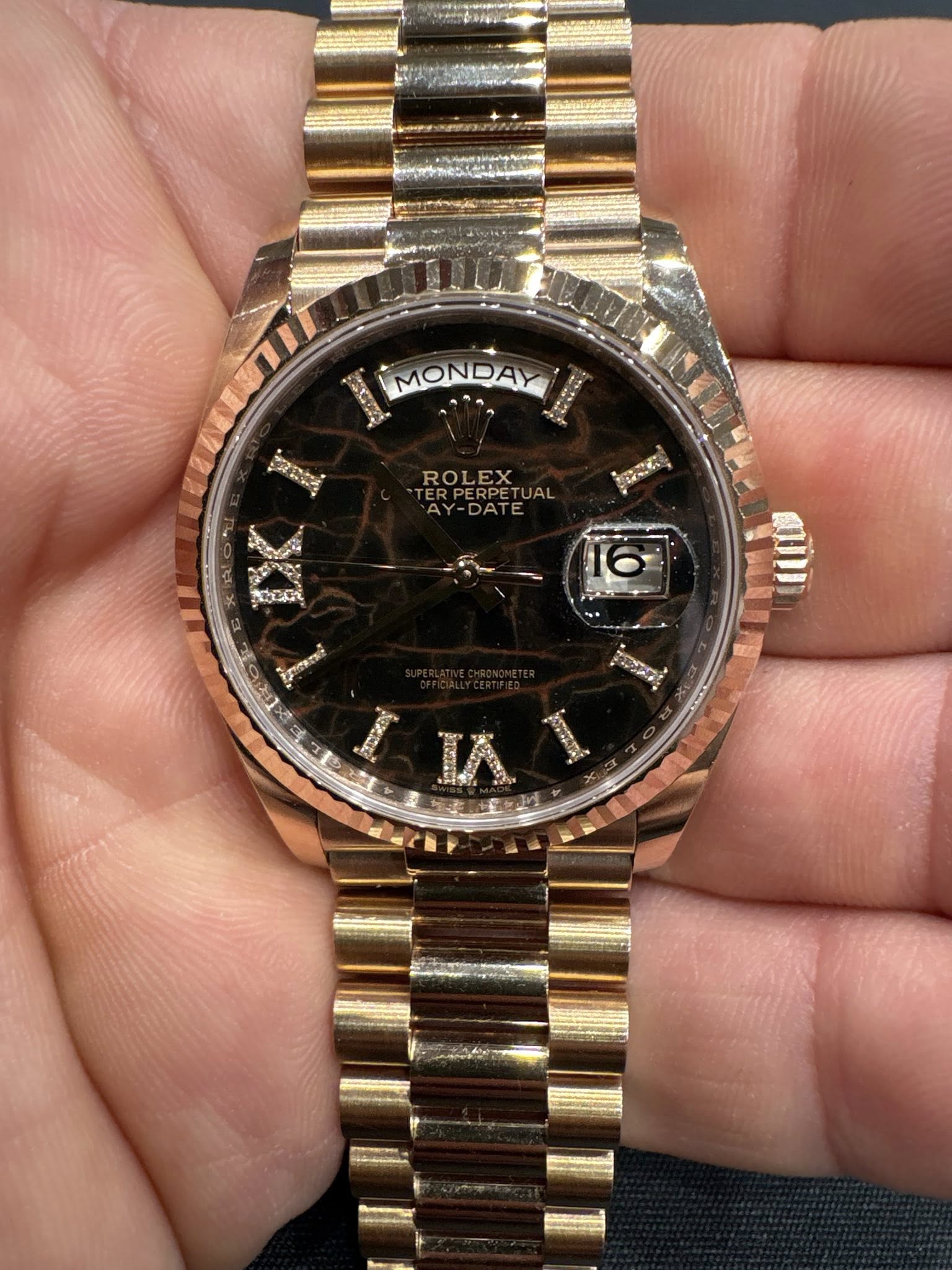 May be an image of wrist watch and text