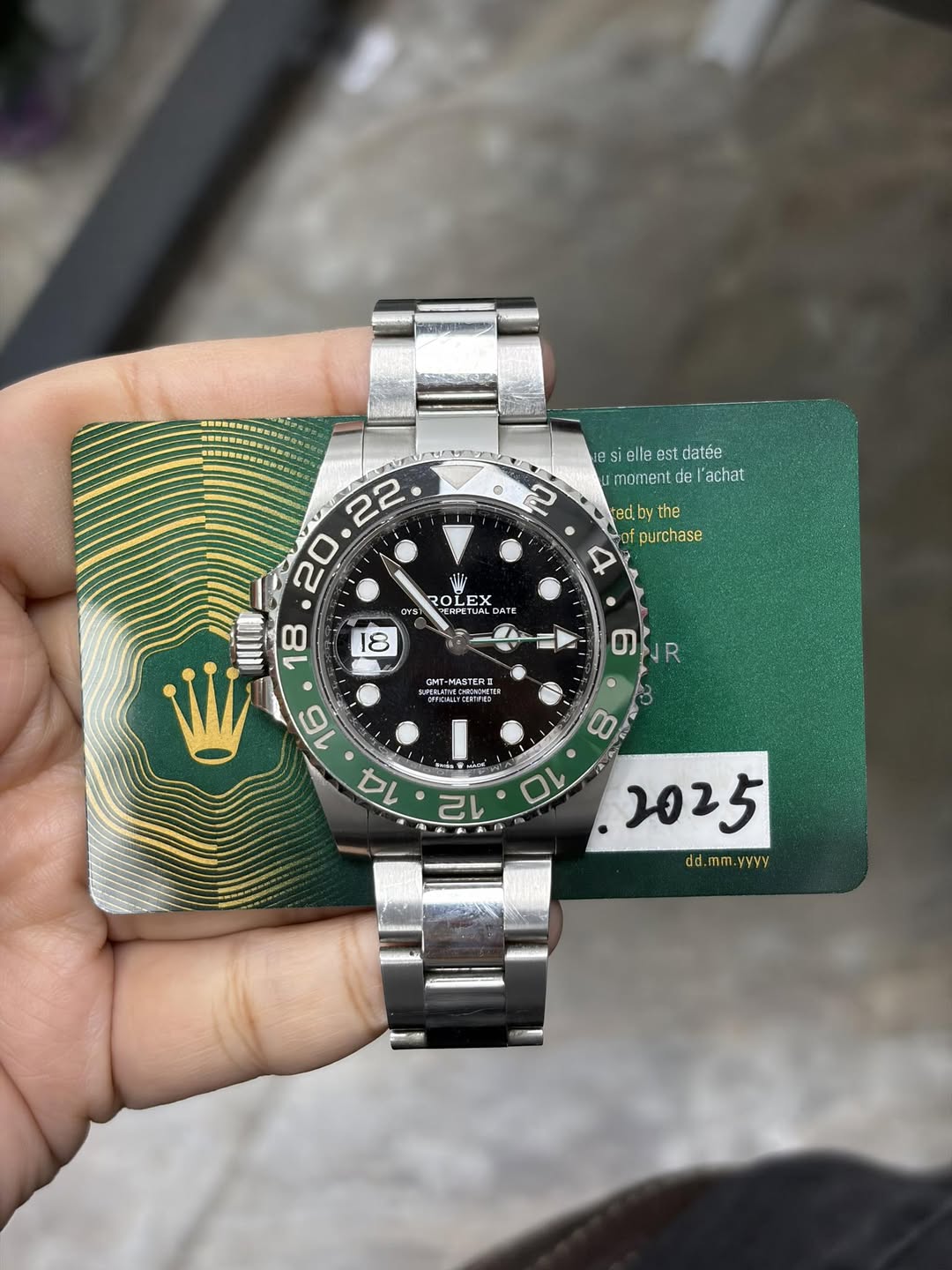 May be an image of wrist watch and text that says 'o sielleestdatée momentde de l'achat ted. ythe purchase 2 30 O OLEX LE มพรัา BEETUALD ΑTe OMT-MASTERI 6 円 عظے dd.mm.yyvy'