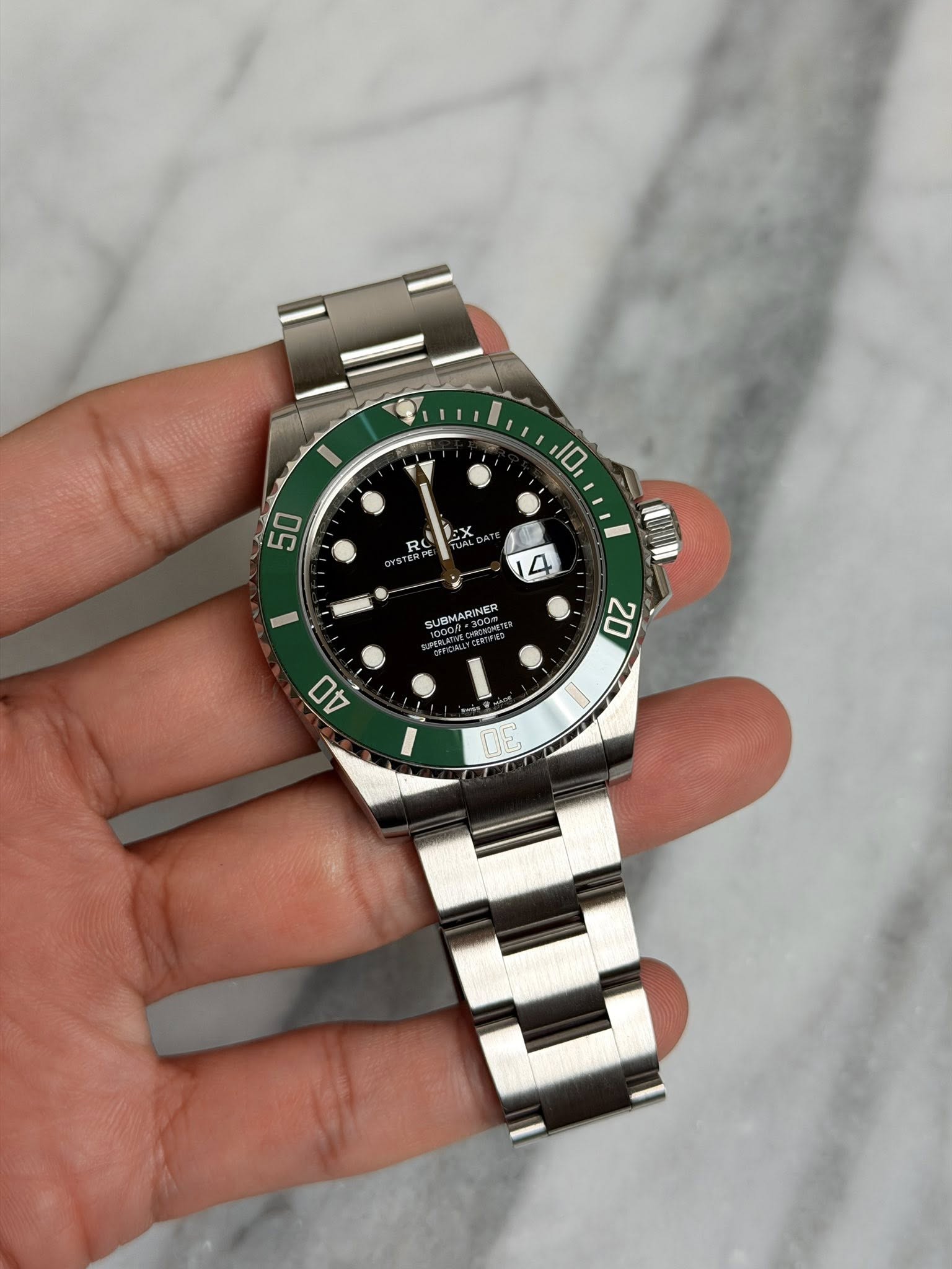 May be an image of wrist watch and text that says 'I 10 50 RO LEx SUBMARINER UBMAR 20 40 - ណា 9'