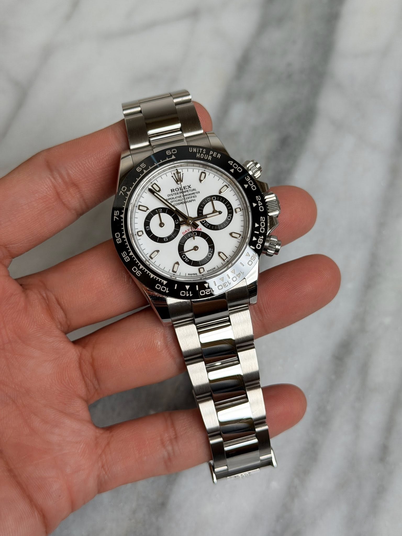 May be an image of wrist watch and text