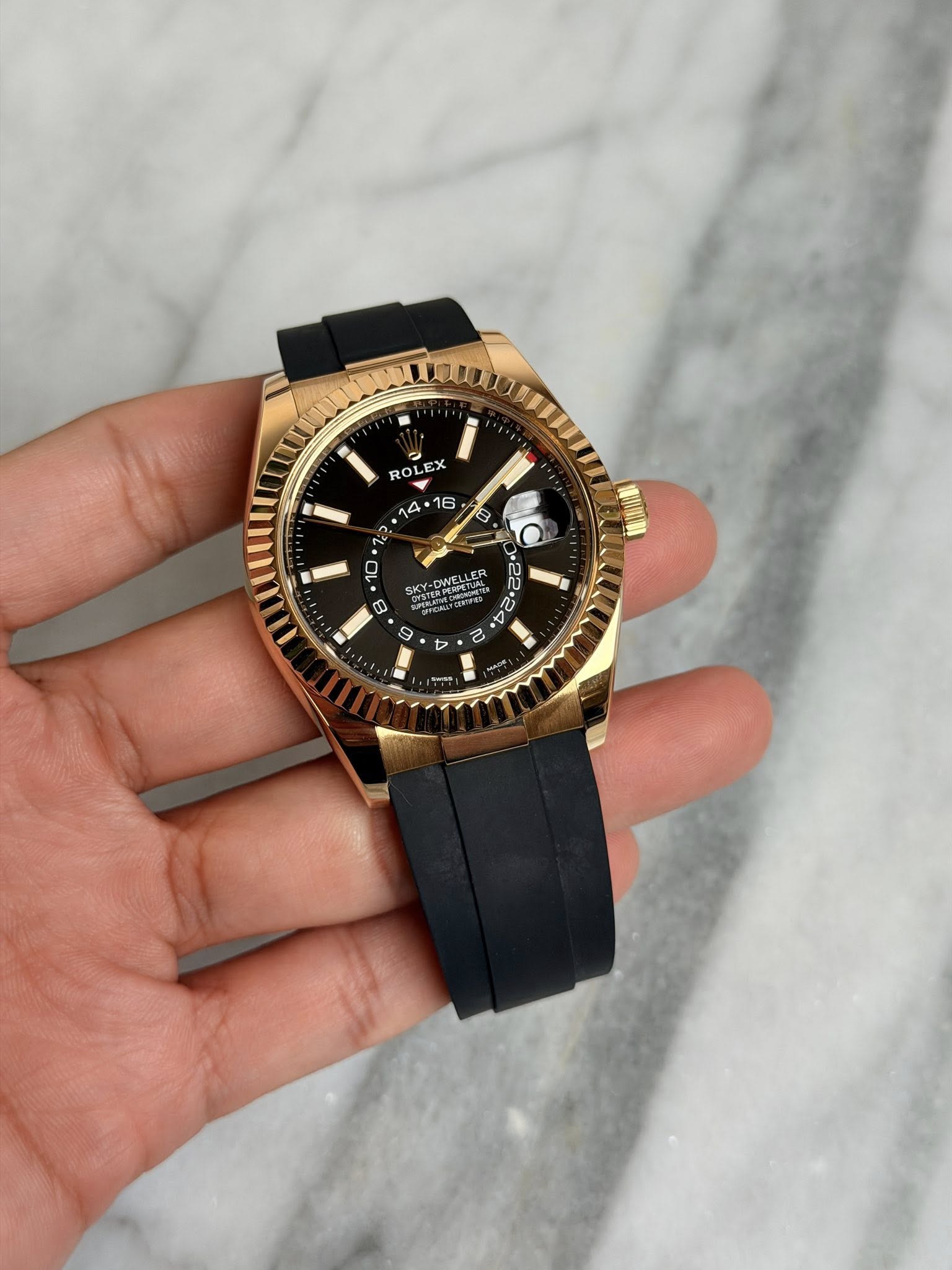 May be an image of wrist watch and text