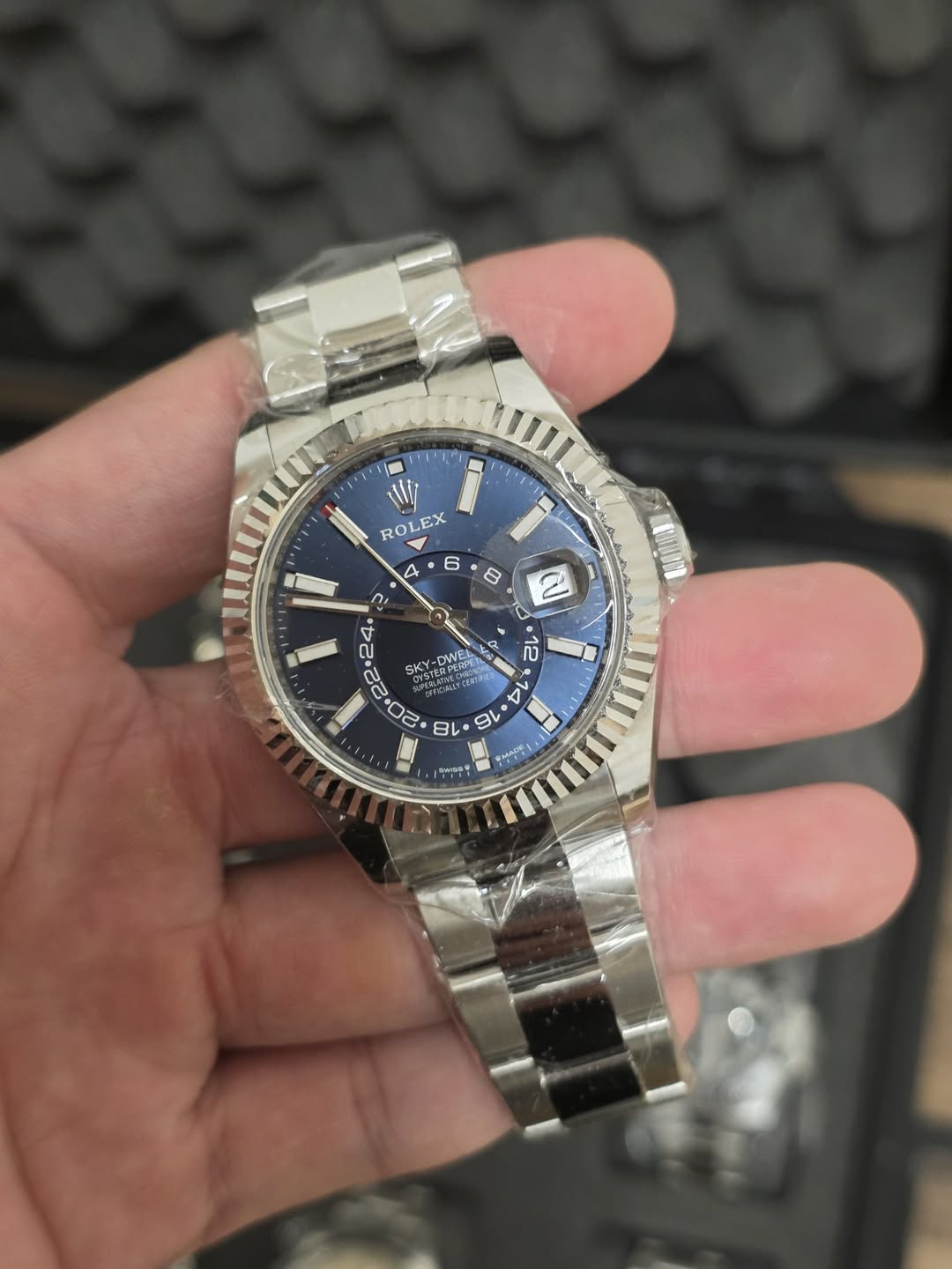 May be an image of wrist watch and text