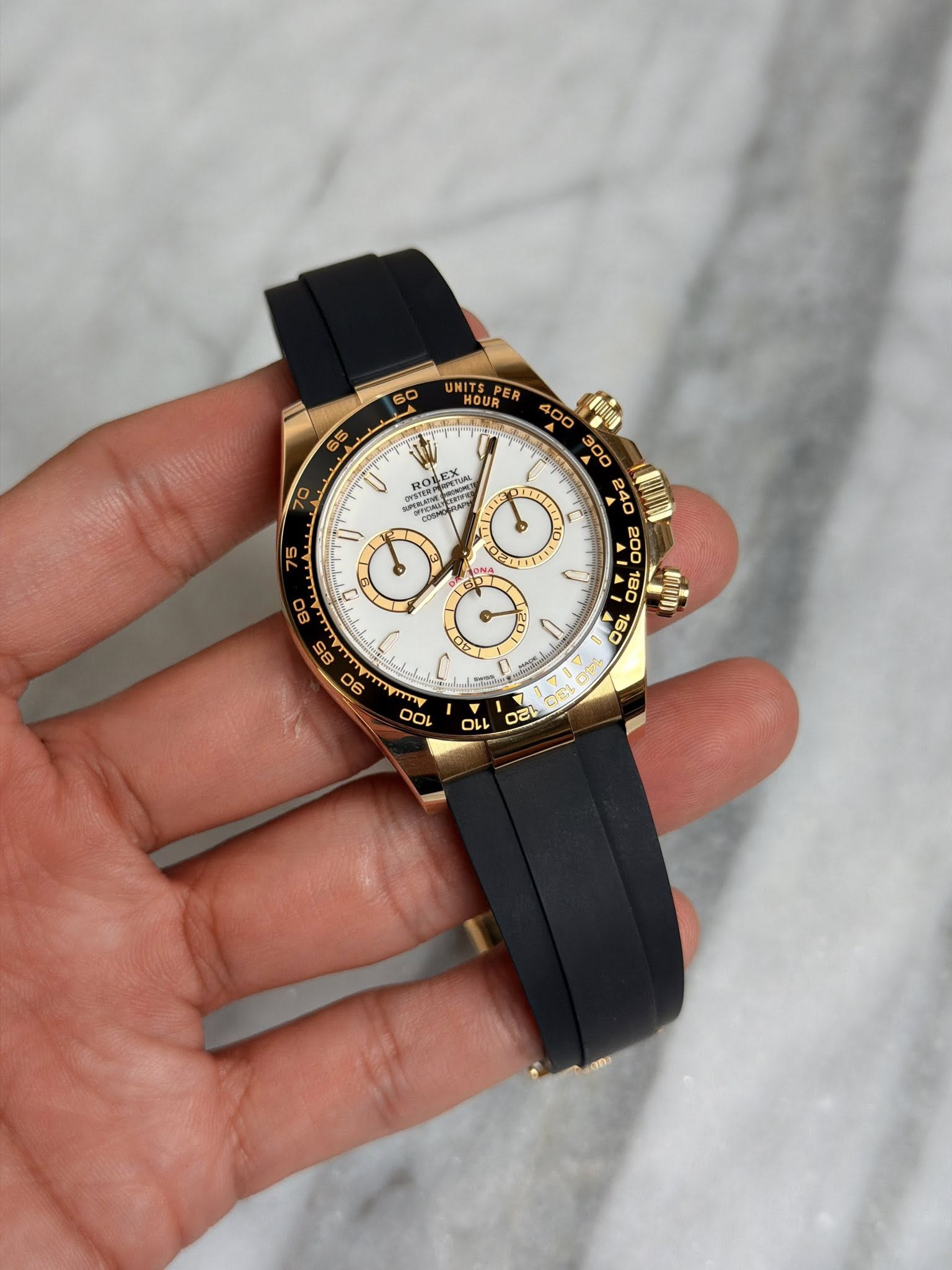 May be an image of wrist watch and text