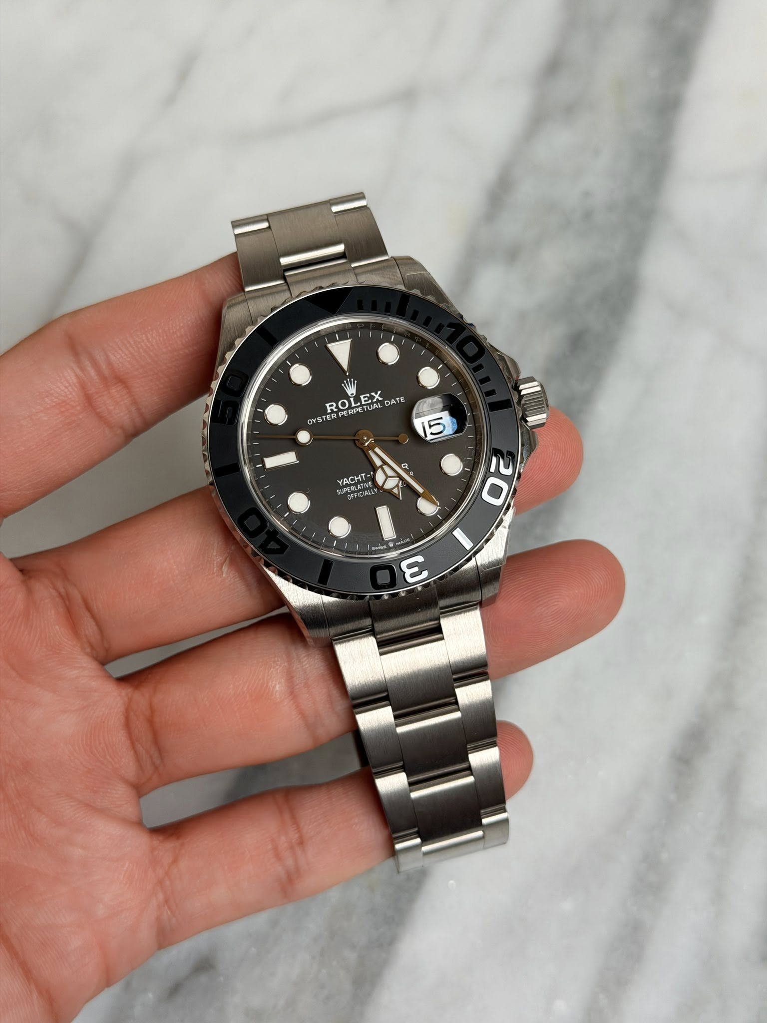 May be an image of wrist watch and text that says 'ROLEX ROLEX ATE O OYSTE I S YACHT . SuP gC CI 20 3'