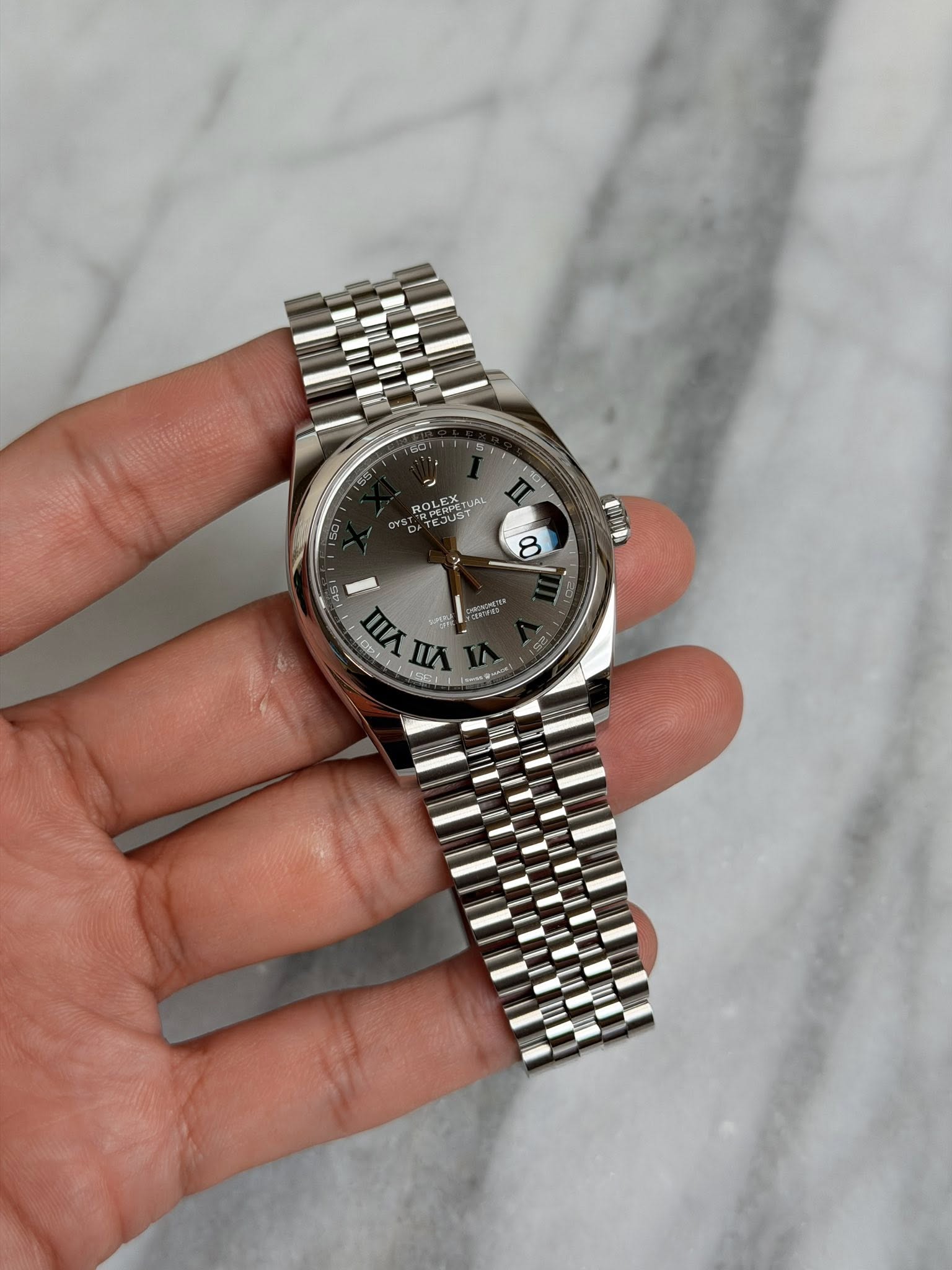 May be an image of wrist watch and text that says 'a KOLEX PE ST LE TUAL YURL Sus UST 8 45 ጠሊ n WЛnA 包 1O9 IA Los'