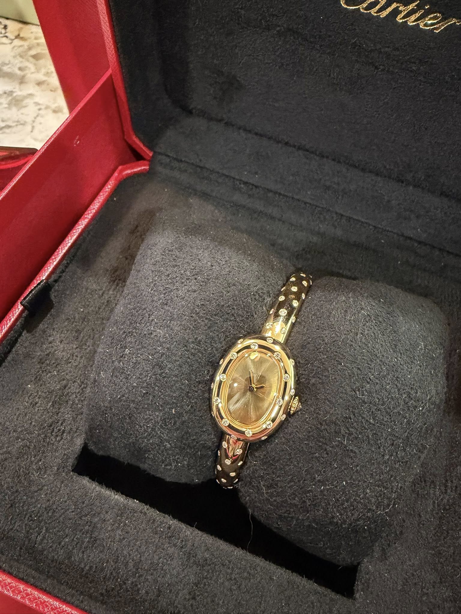 May be an image of wrist watch and text