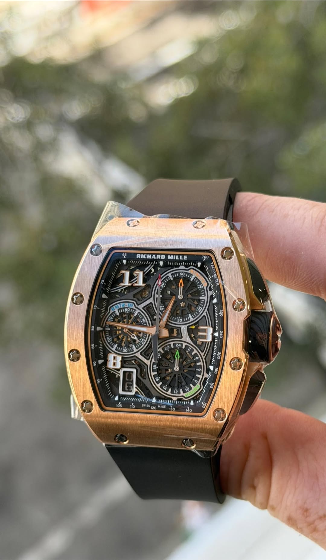 May be an image of wrist watch and text