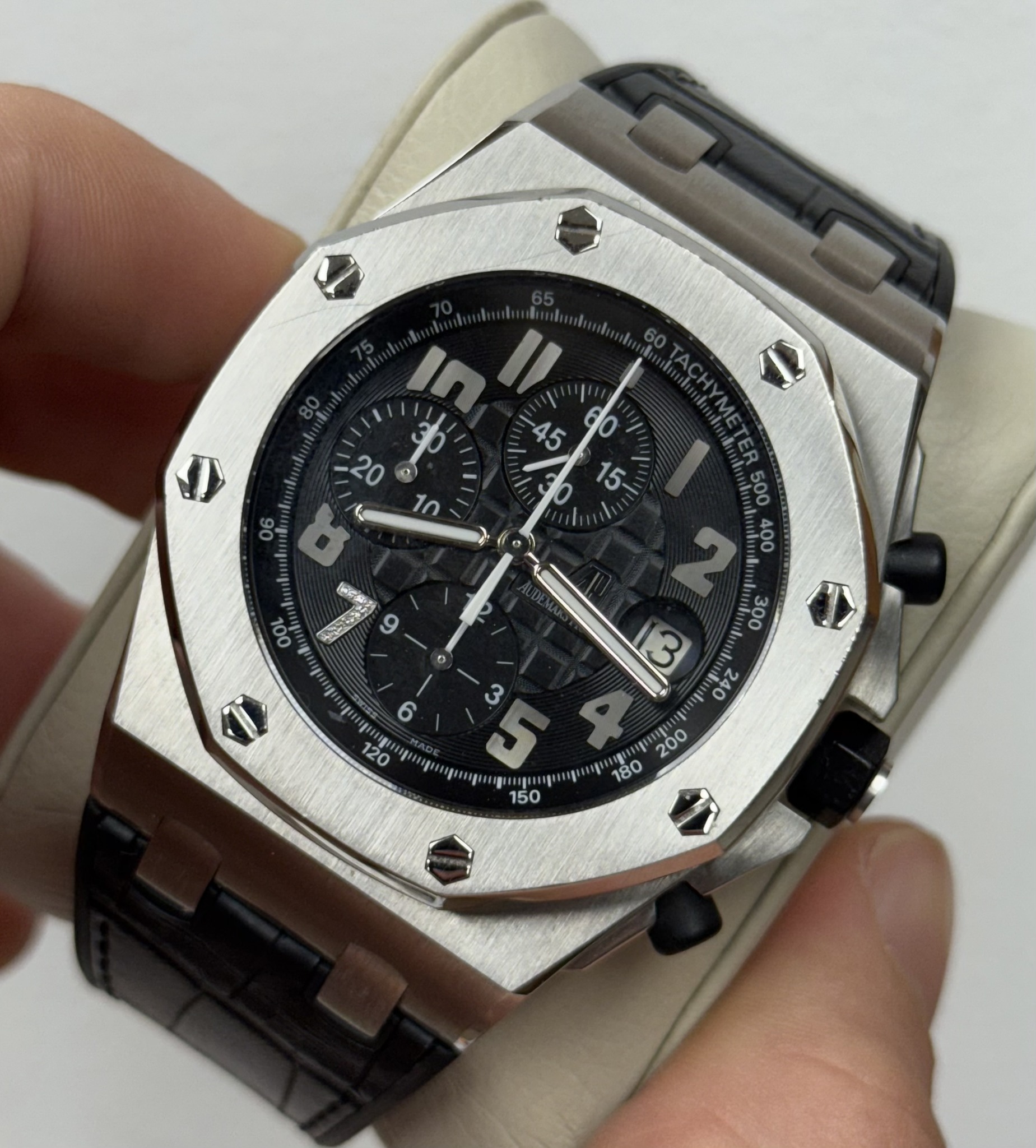 May be an image of wrist watch and text