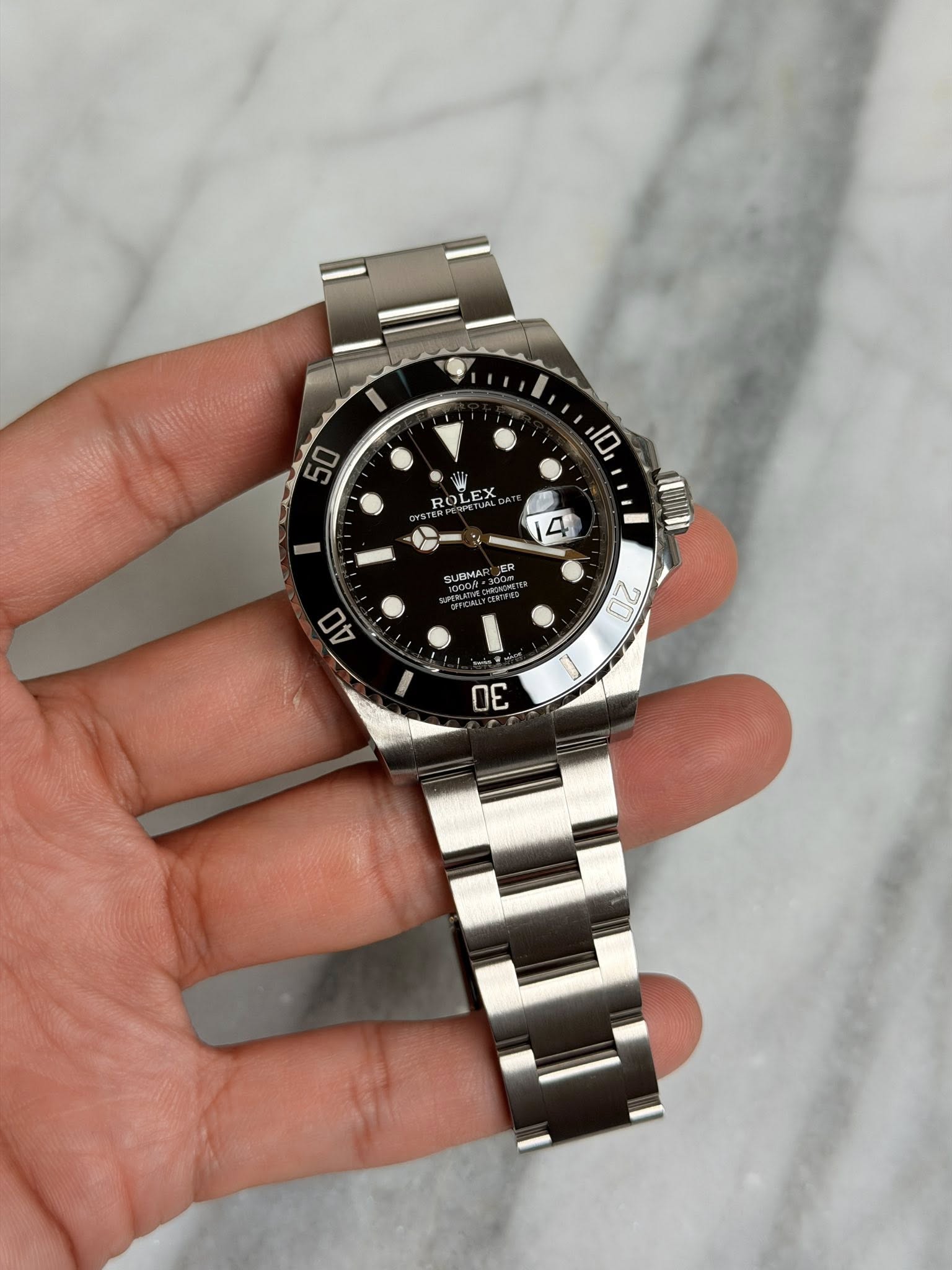 May be an image of wrist watch and text that says 'I 50 10 ROLEA LEX 4 UUMA ER 4O 20 0ር'