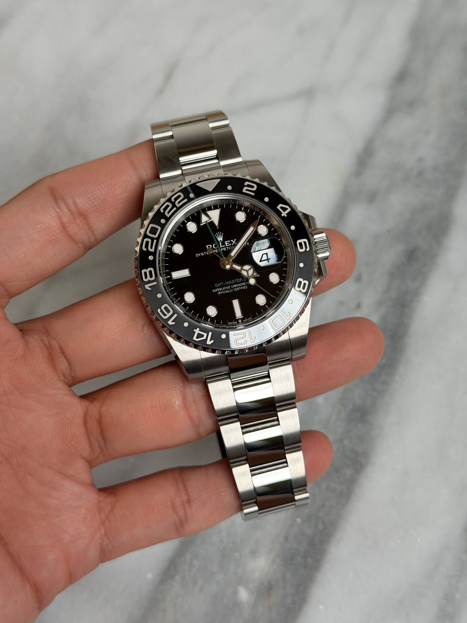 May be an image of wrist watch and text