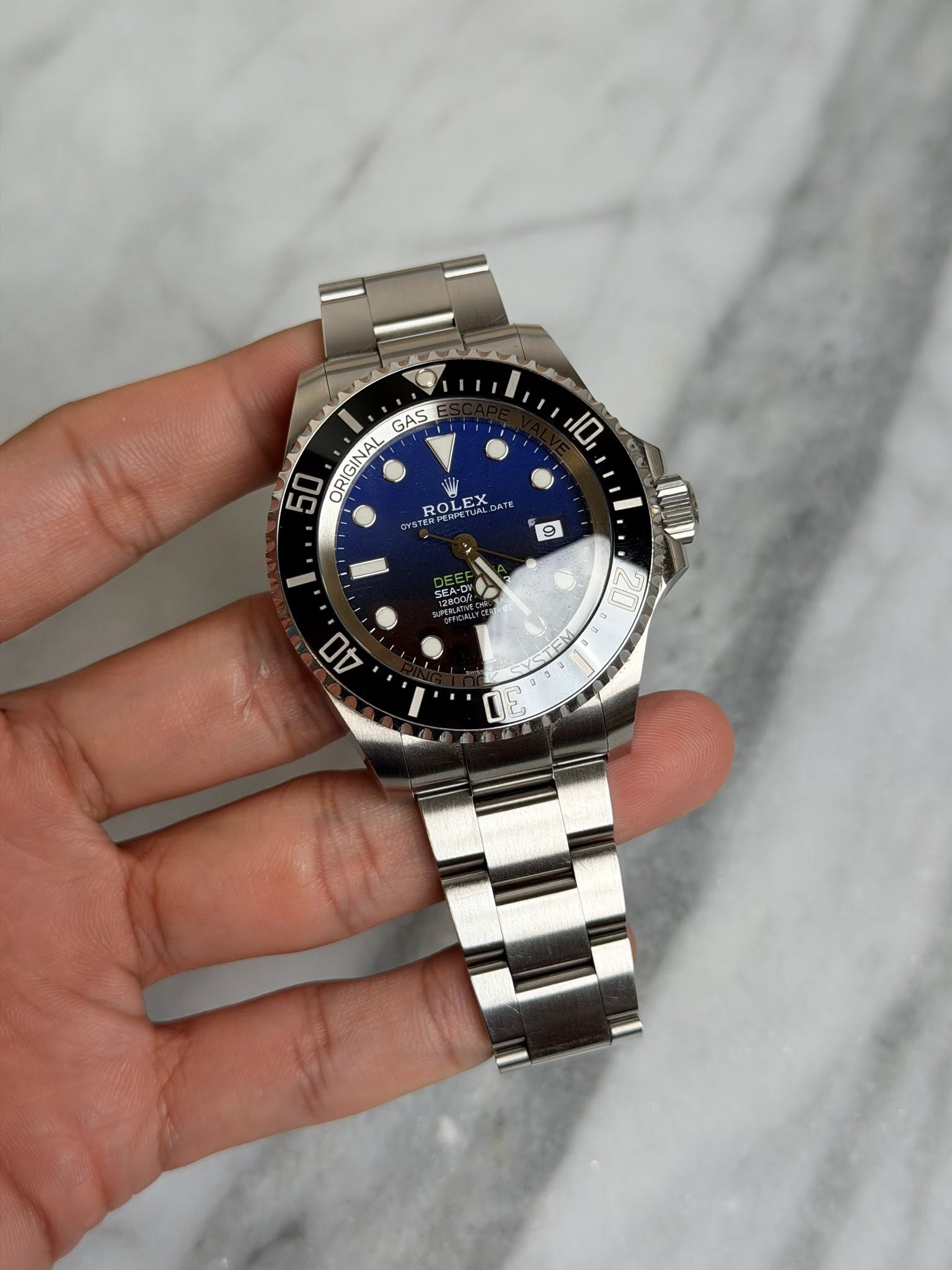 May be an image of wrist watch and text that says 'GAS 50 ORIGINAL 10 ROL ROLEX 9 40'