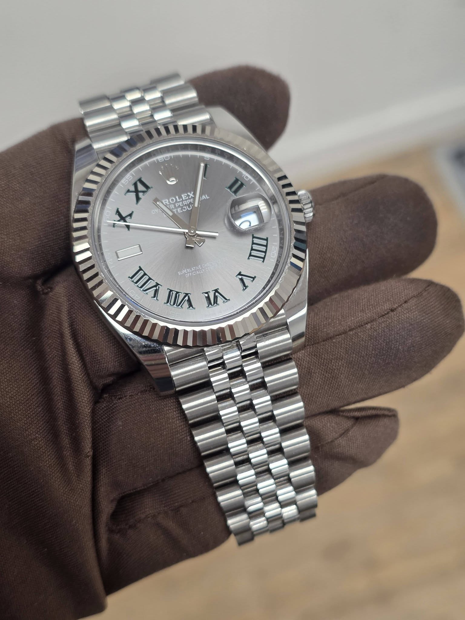 May be an image of wrist watch and text