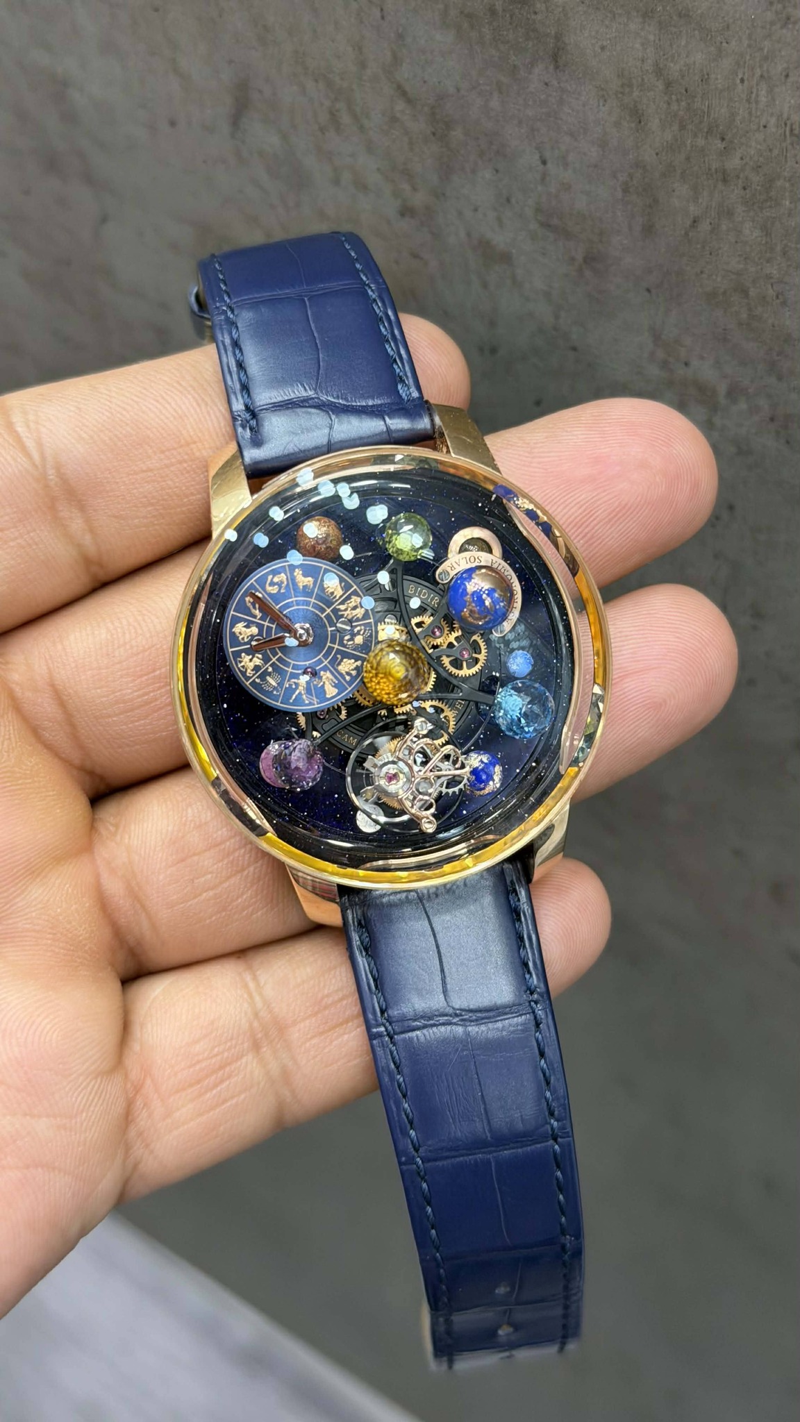 May be an image of wrist watch and text