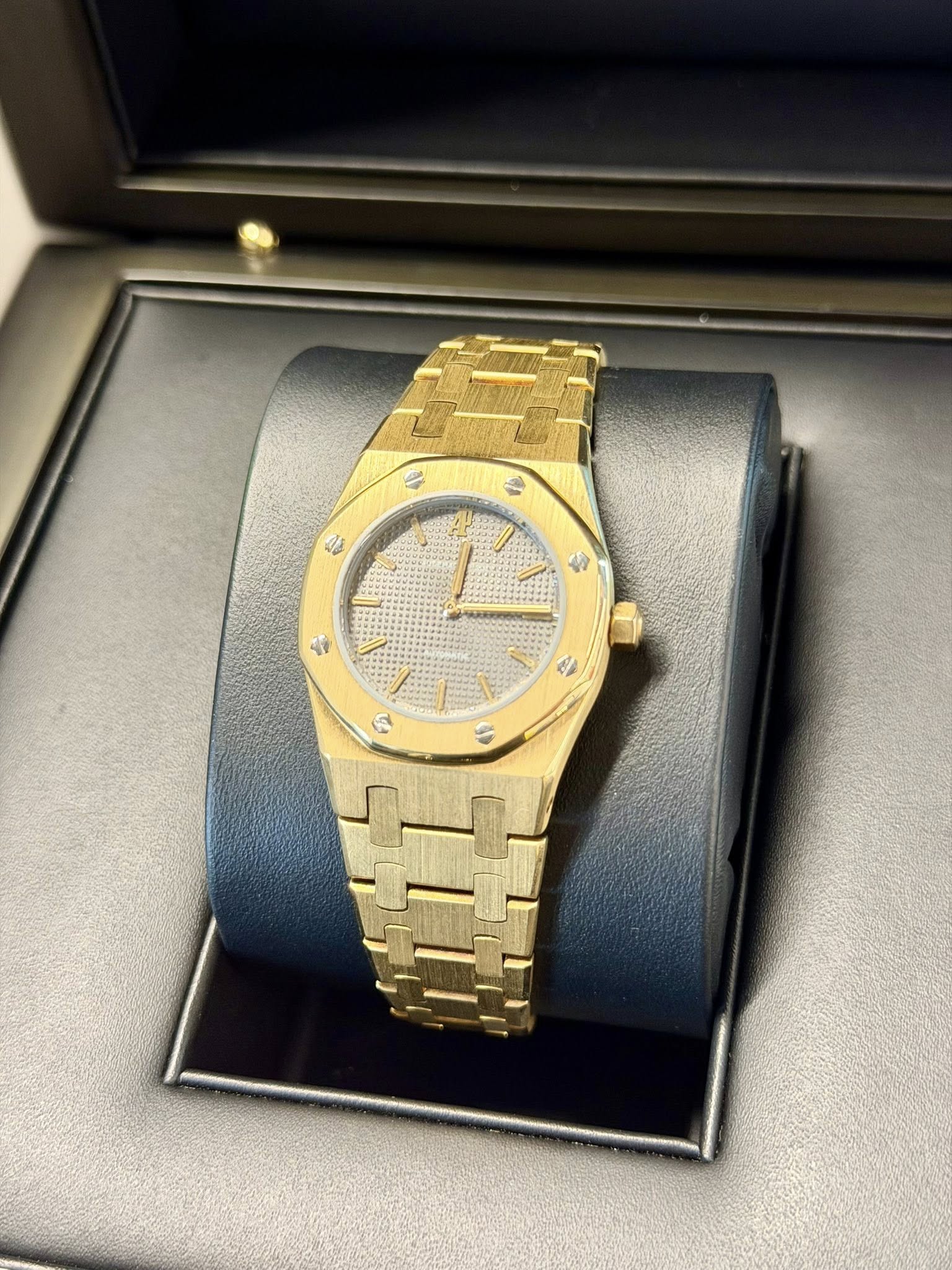May be an image of wrist watch and text