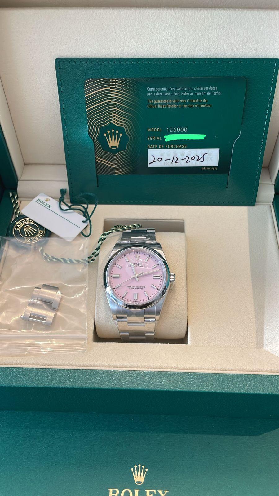 May be an image of wrist watch, jewelry and text