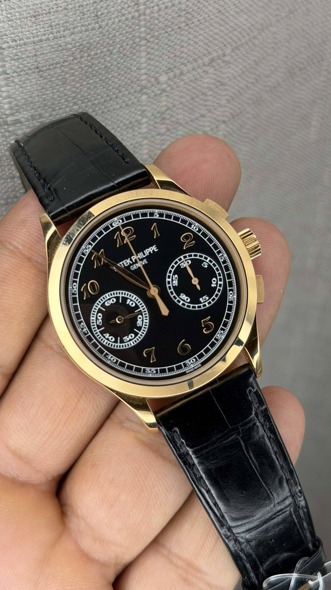 May be an image of wrist watch and text