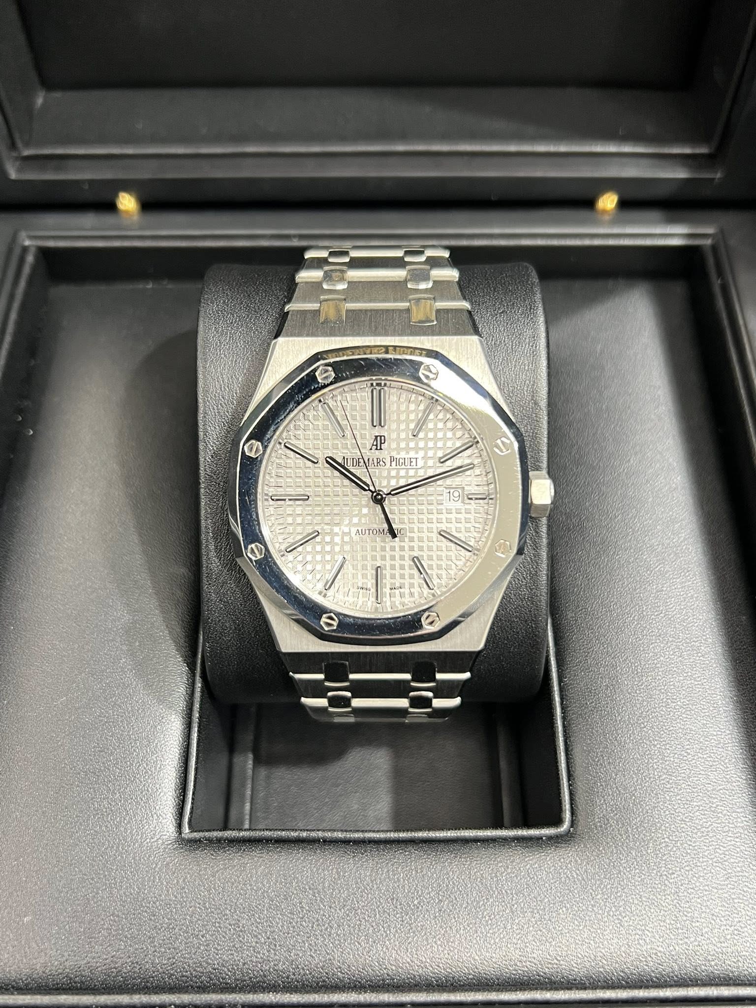 May be an image of wrist watch and text