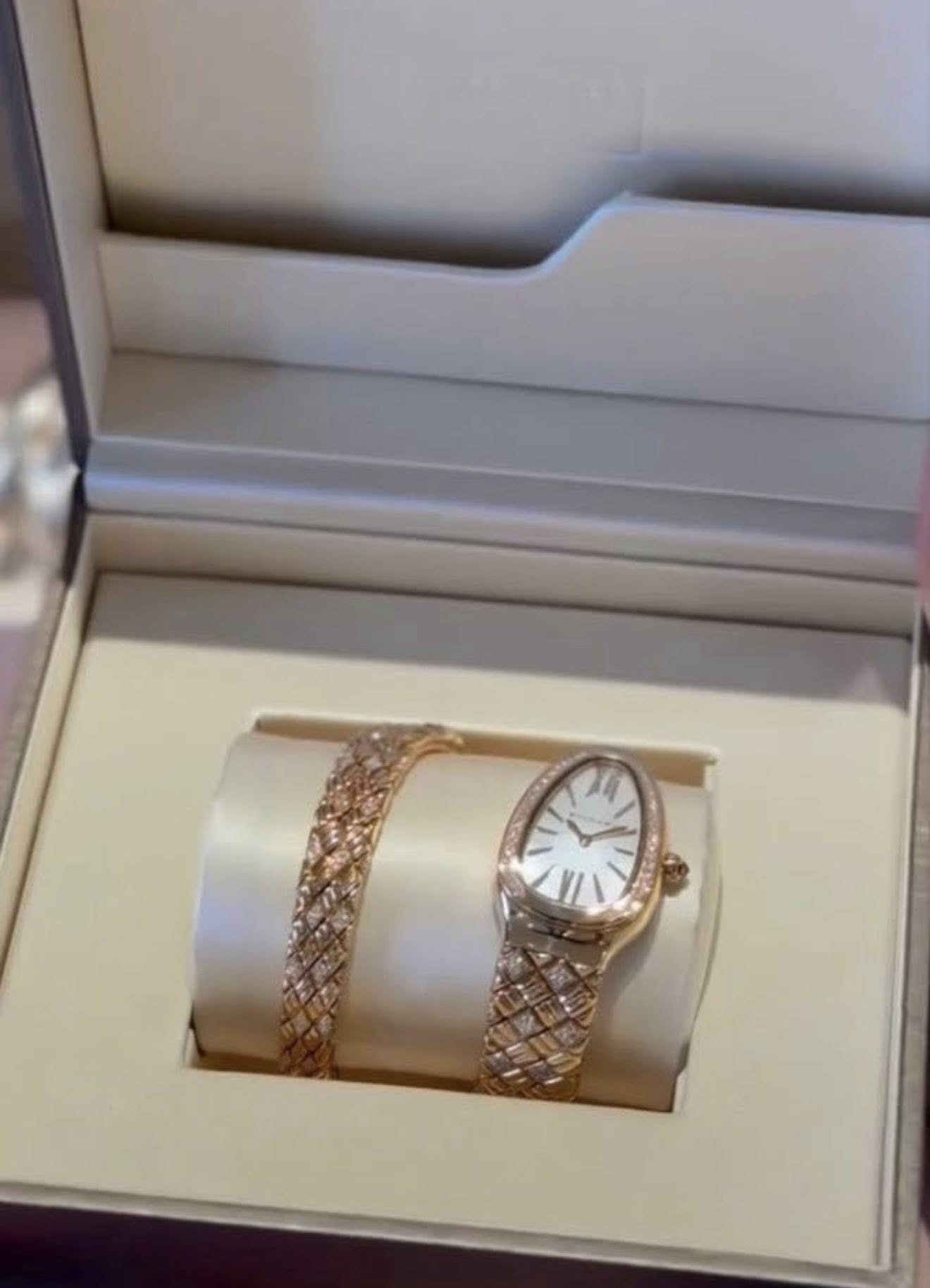 May be an image of wrist watch and jewelry