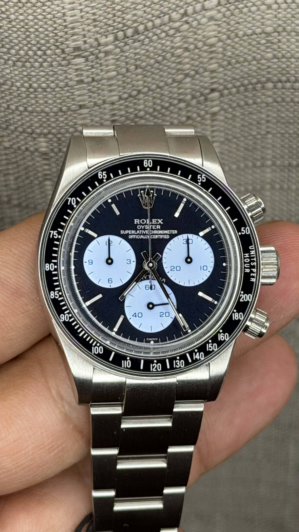 May be an image of wrist watch and text