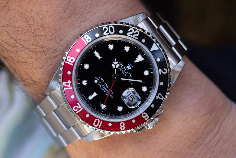 May be an image of wrist watch and text