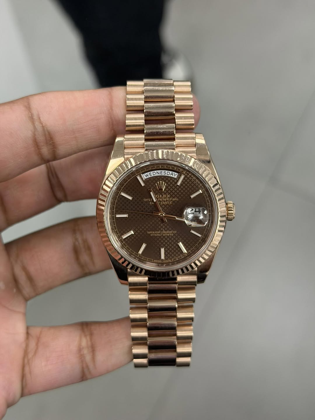 May be an image of wrist watch and text