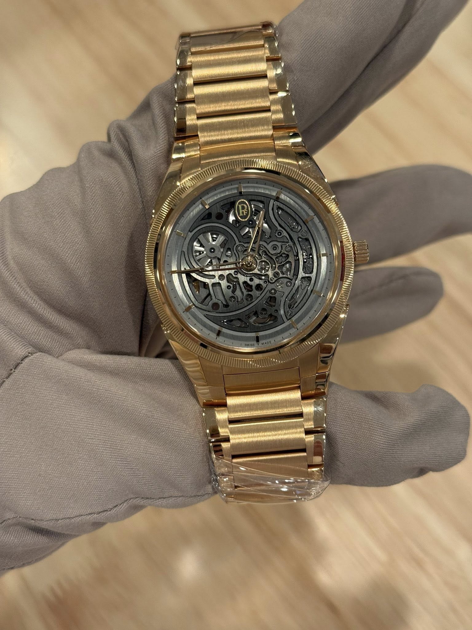 May be an image of wrist watch and text