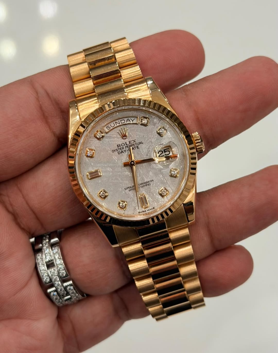 May be an image of wrist watch and text