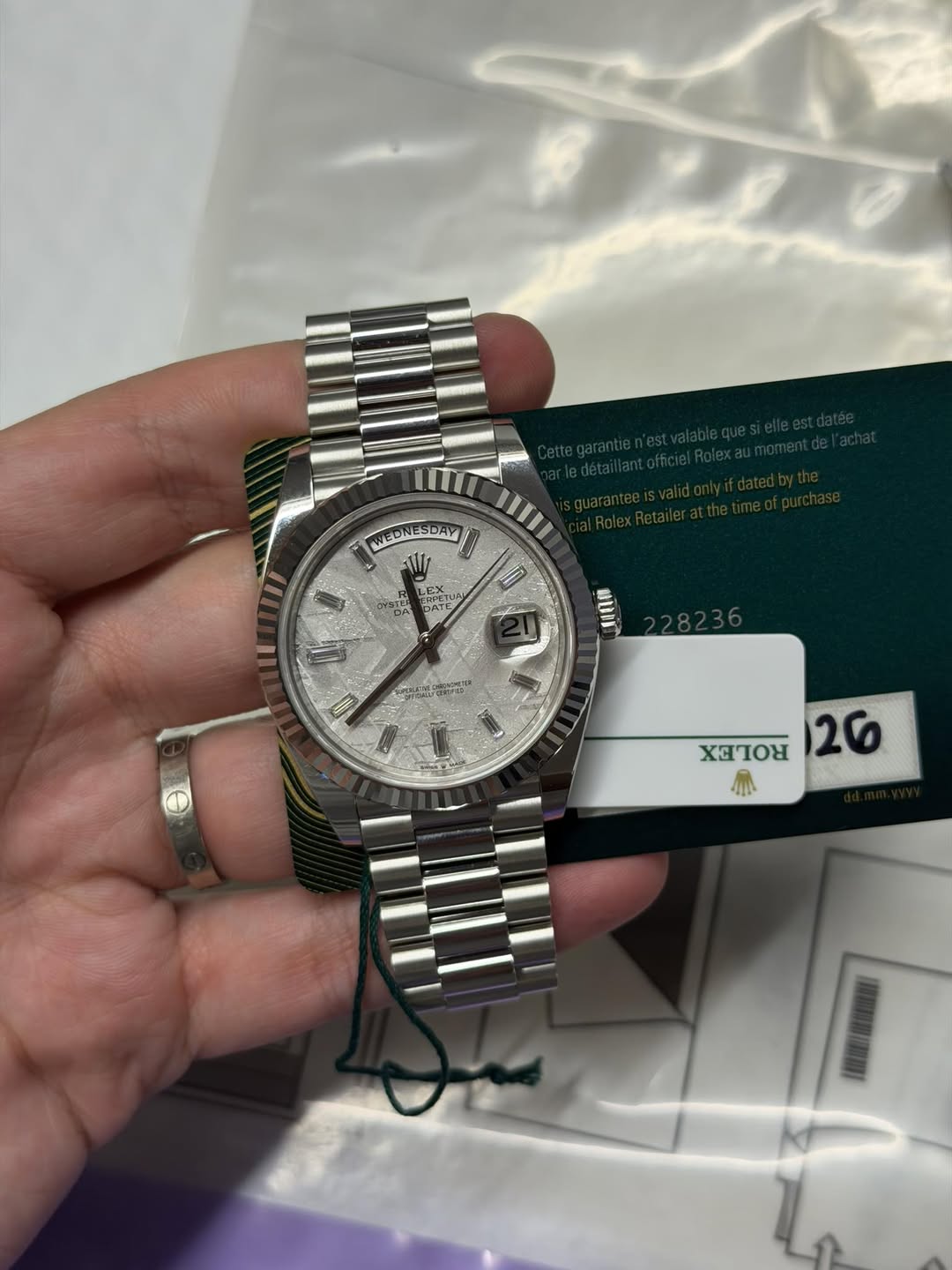 May be an image of wrist watch and text