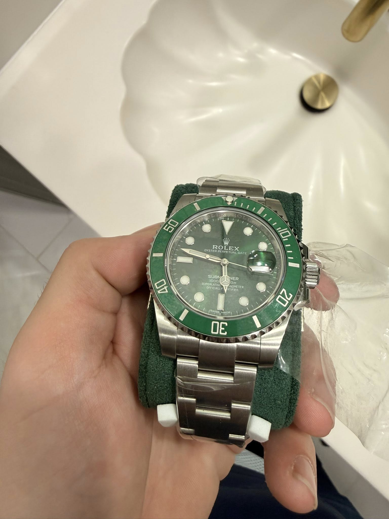 May be an image of wrist watch and text