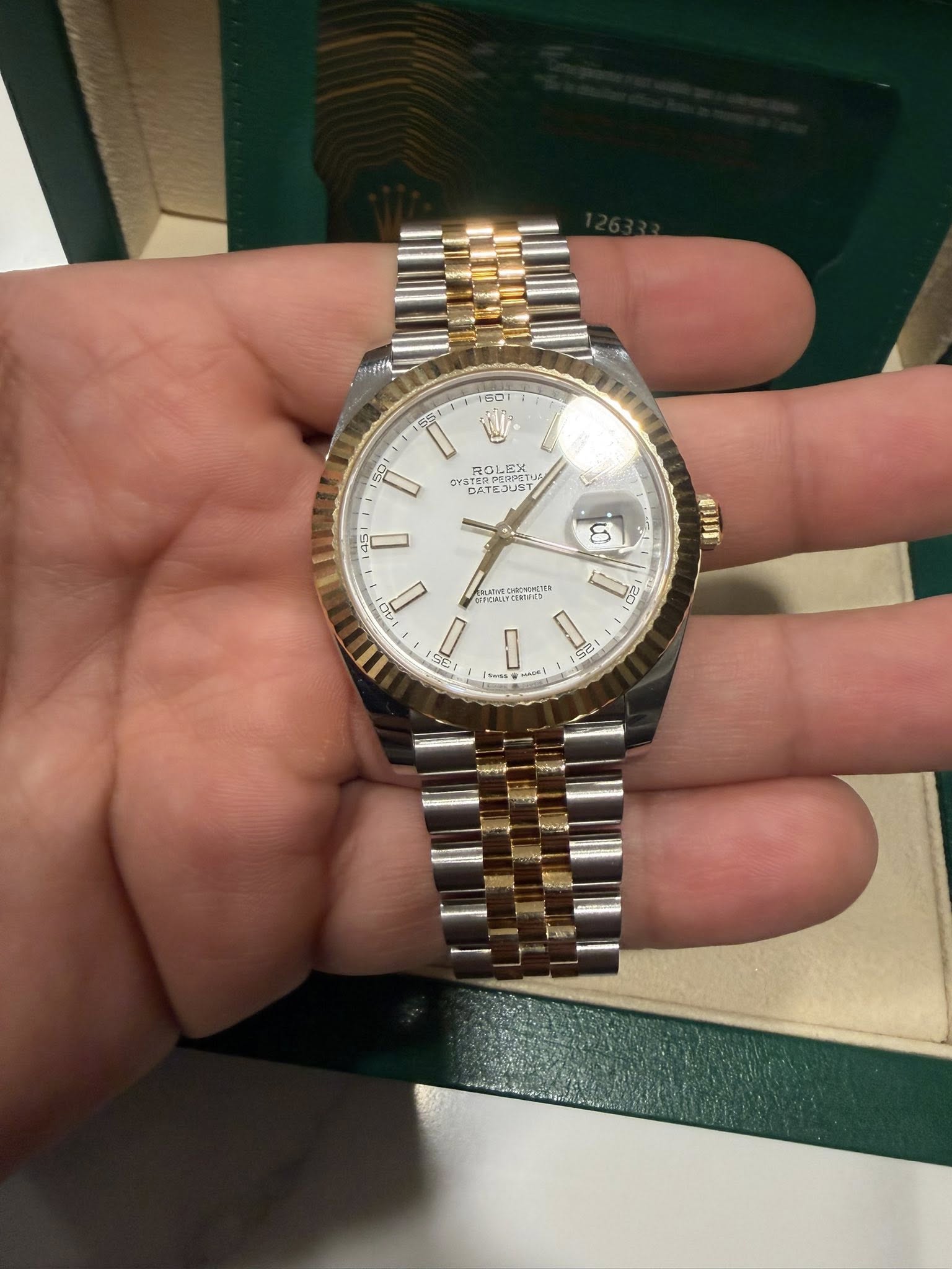 May be an image of wrist watch and text